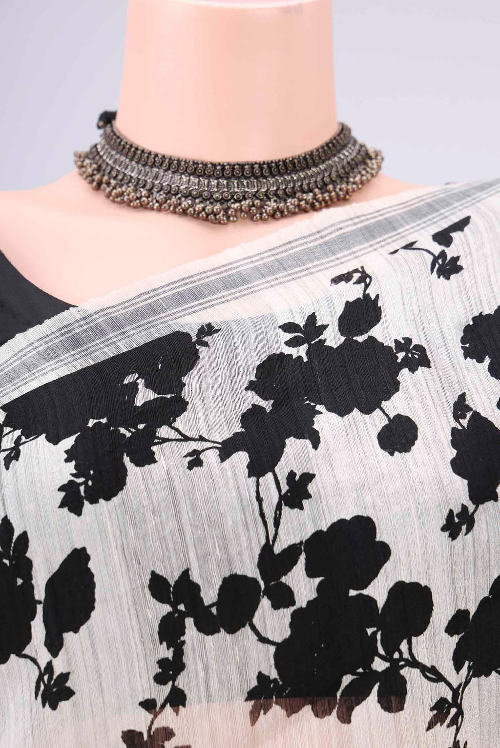 Border image of Off White Tussar Silk Saree with Floral Print on the body and Plain Border. 