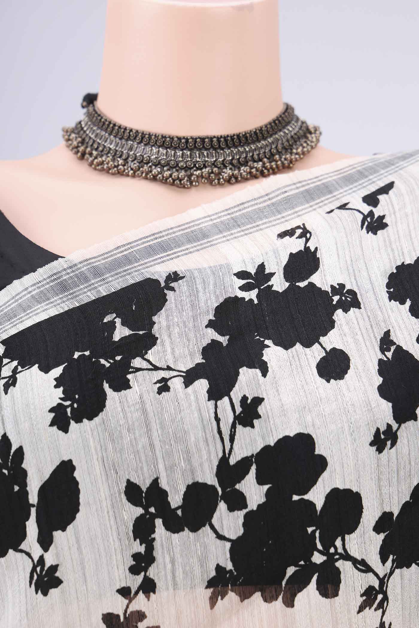 Border image of Off White Tussar Silk Saree with Floral Print on the body and Plain Border. 