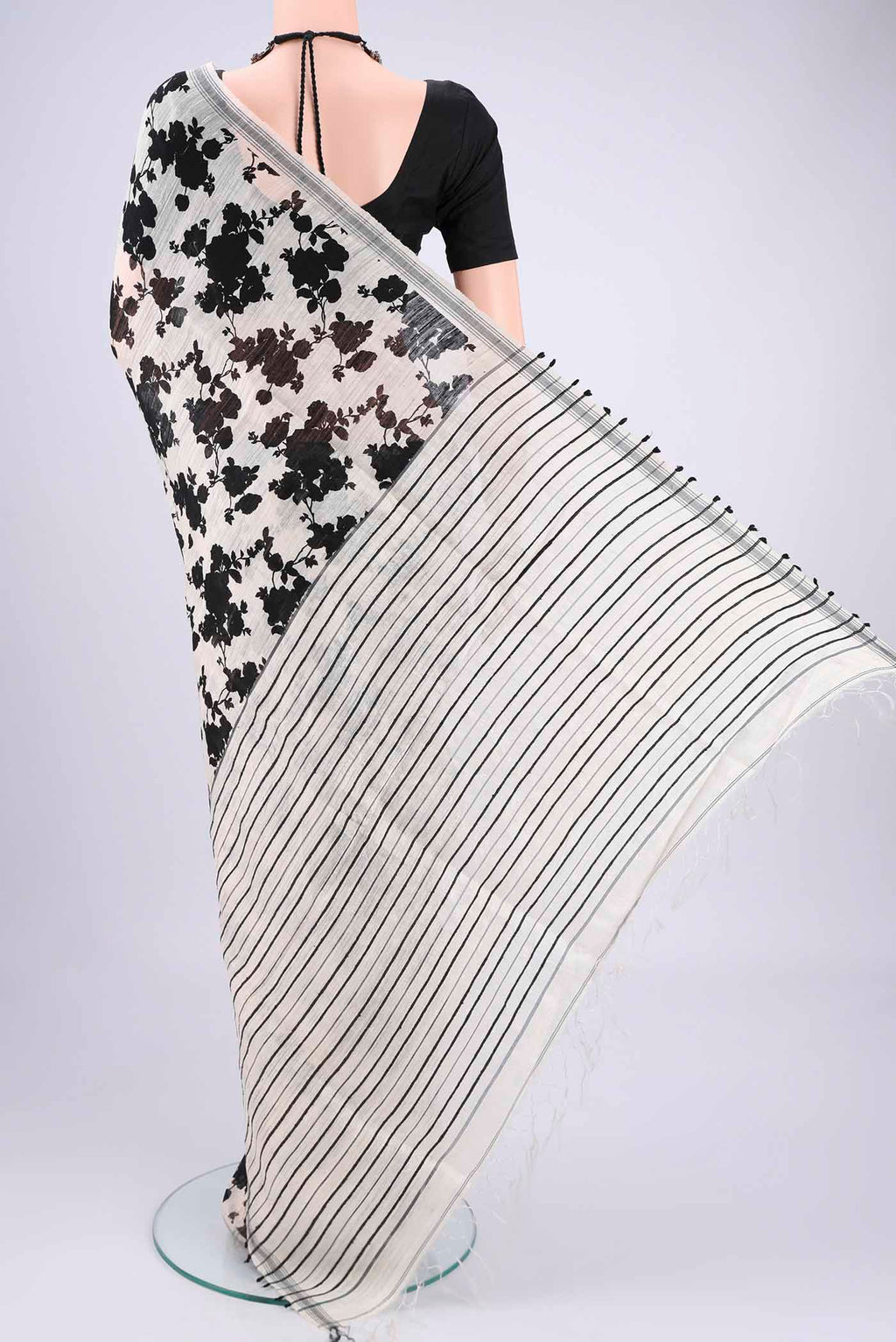 Flat view of Off White Tussar Silk Saree with Floral Print on the body and Plain Border. 