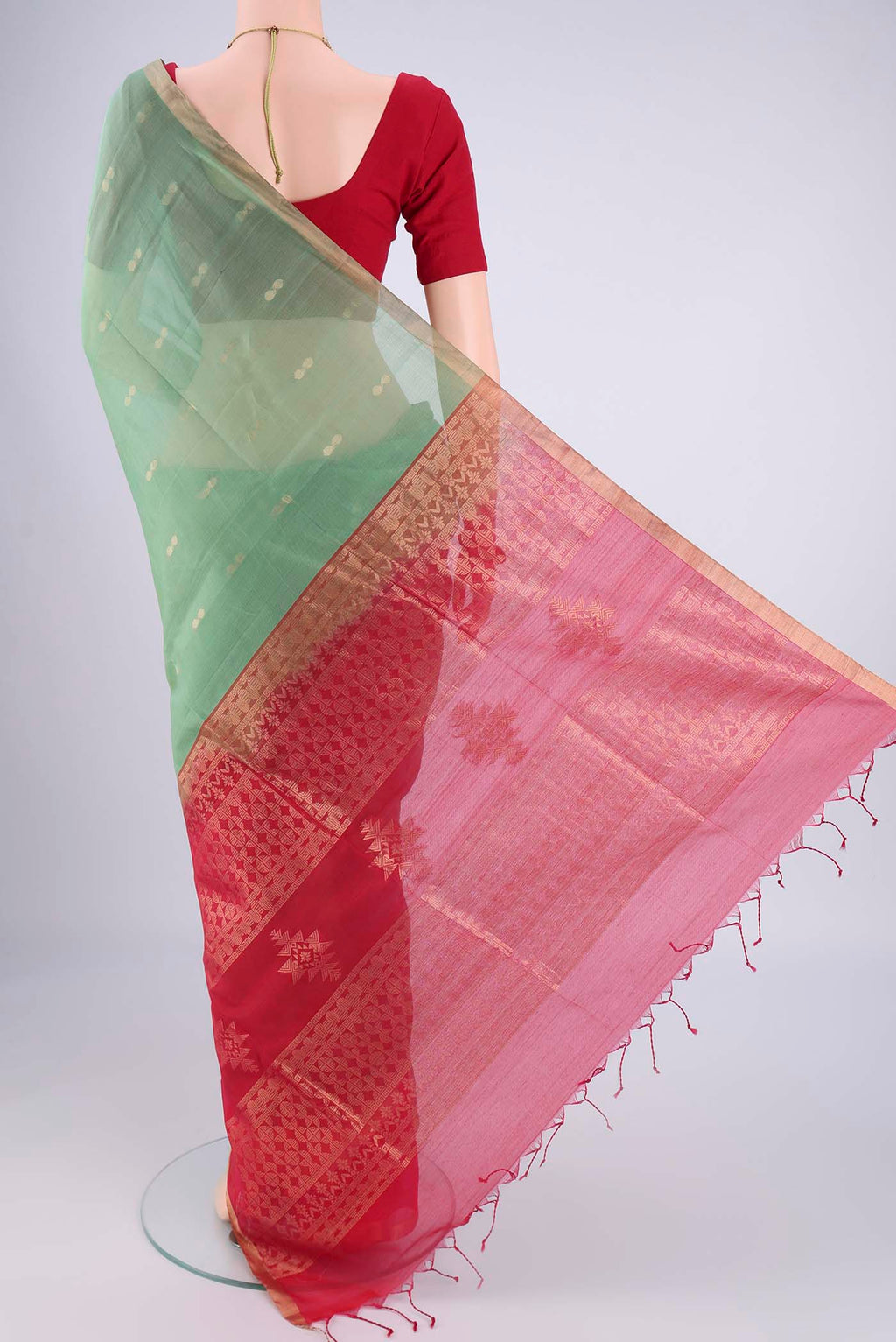 Flat view of Sea Green Silk Cotton Saree with Zari Brocade on the body and Zari Border. 