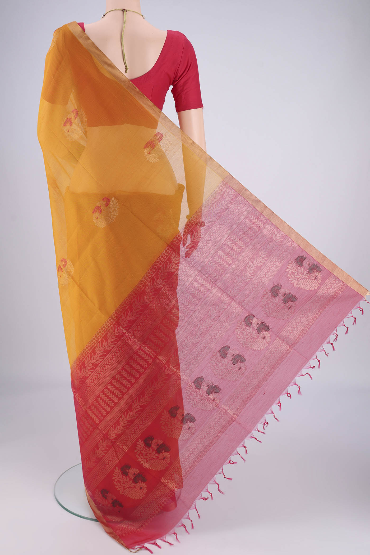 Flat view of Mustard Silk Cotton Saree with Zari Brocade on the body and Zari Border. 