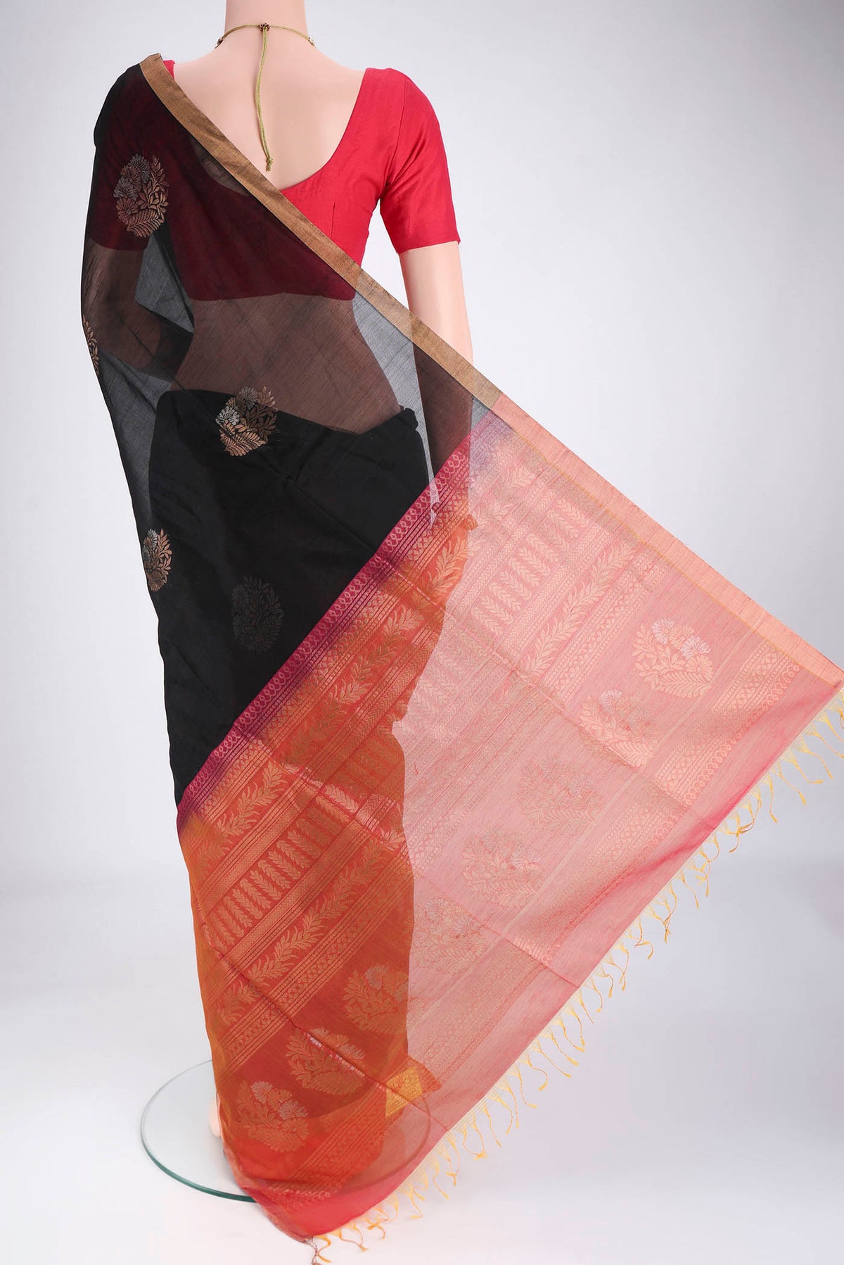 Flat view of Black Silk Cotton Saree with Zari Brocade on the body and Zari Border. 