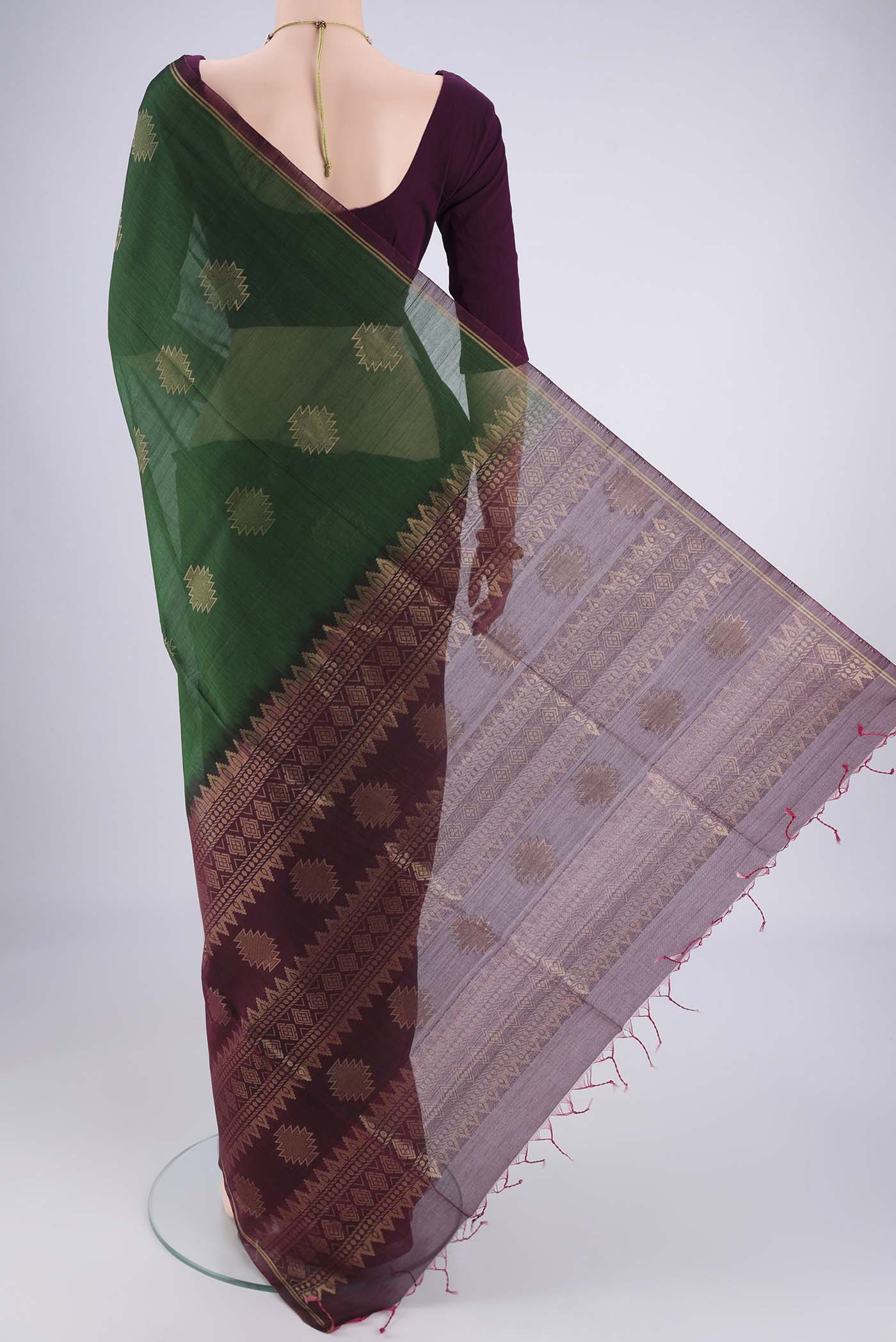 Flat view of Bottle Green Silk Cotton Saree with Zari Brocade on the body and Zari Border. 