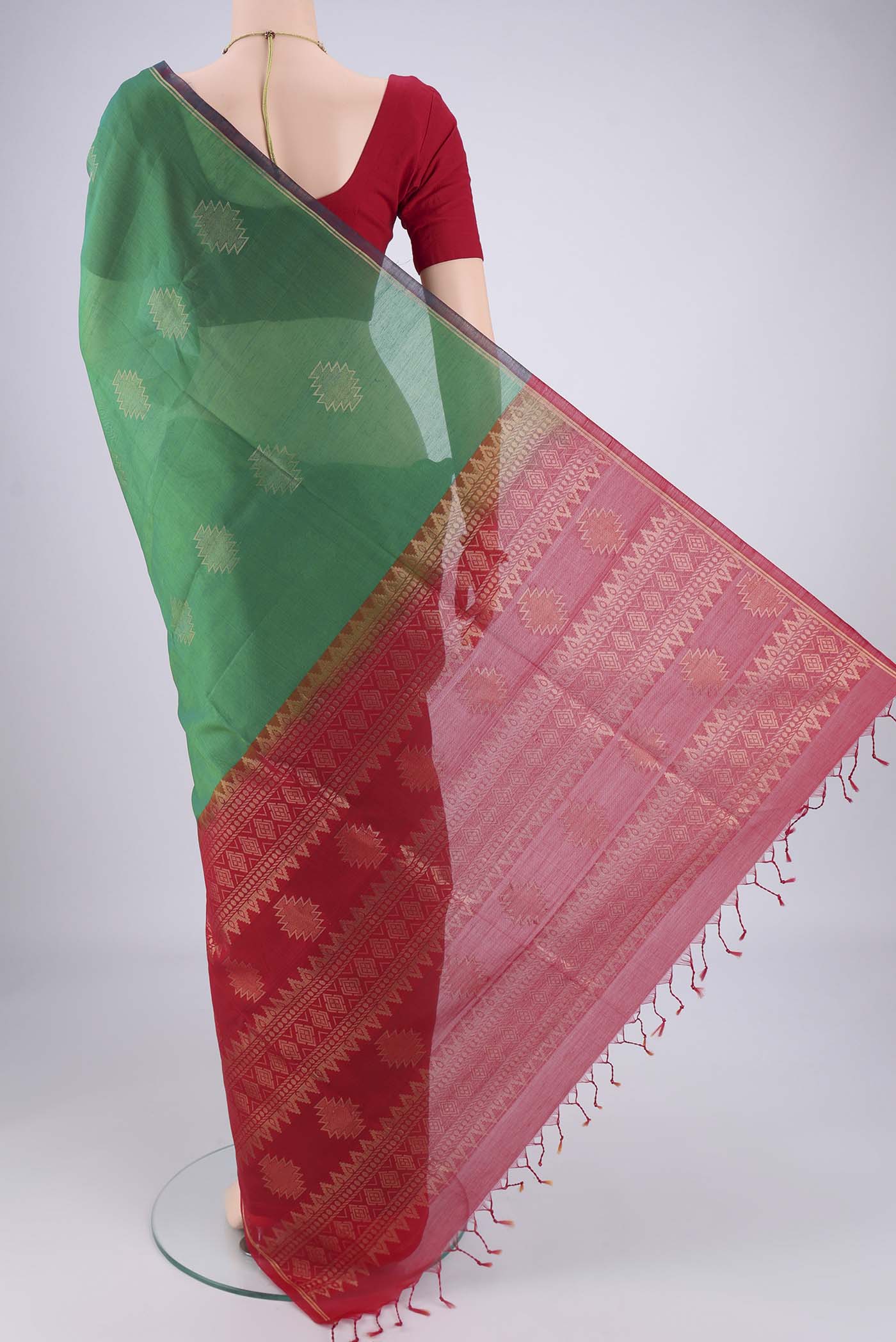 Flat view of Green Silk Cotton Saree with Zari Brocade on the body and Zari Border. 