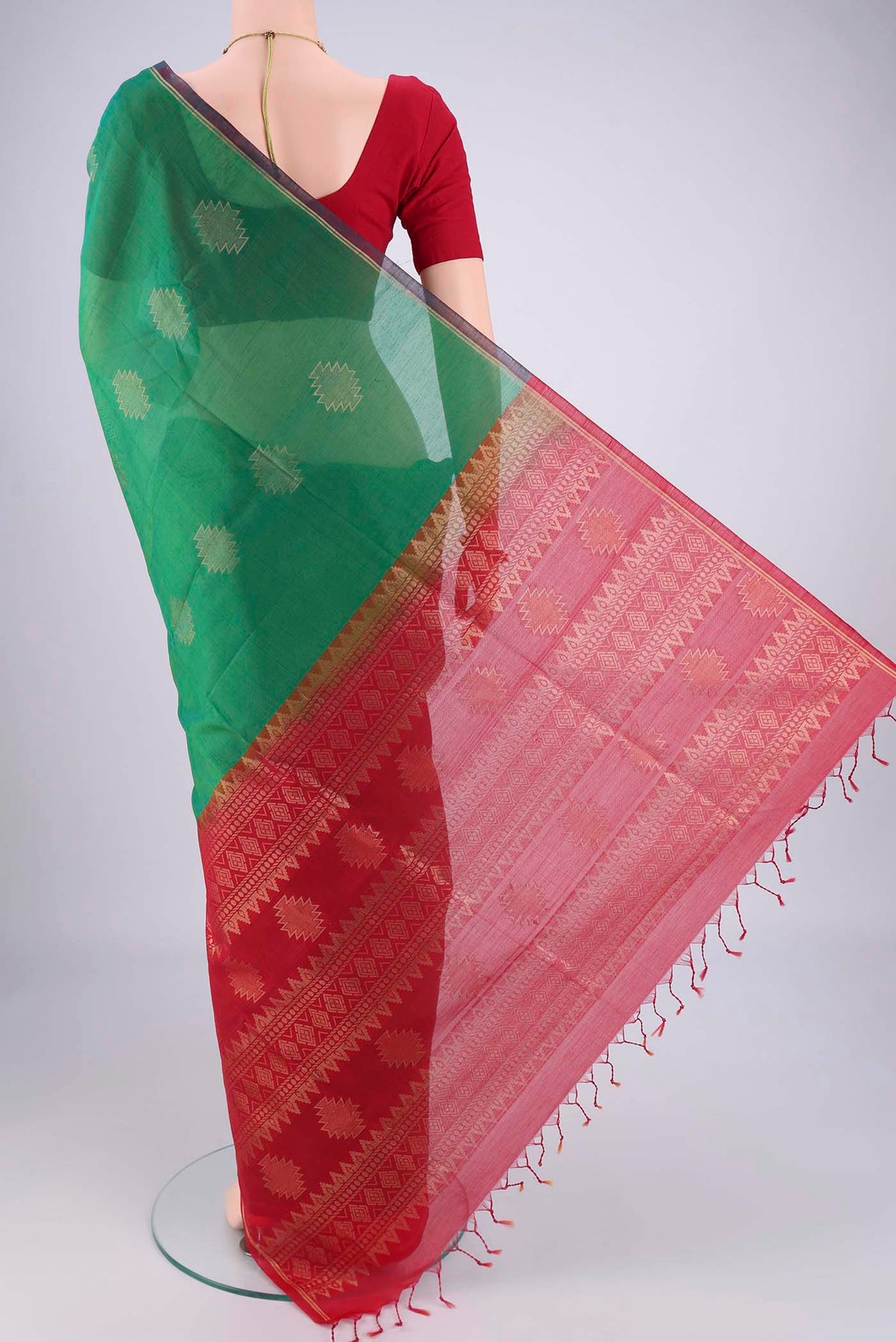 Flat view of Green Silk Cotton Saree with Zari Brocade on the body and Zari Border. 
