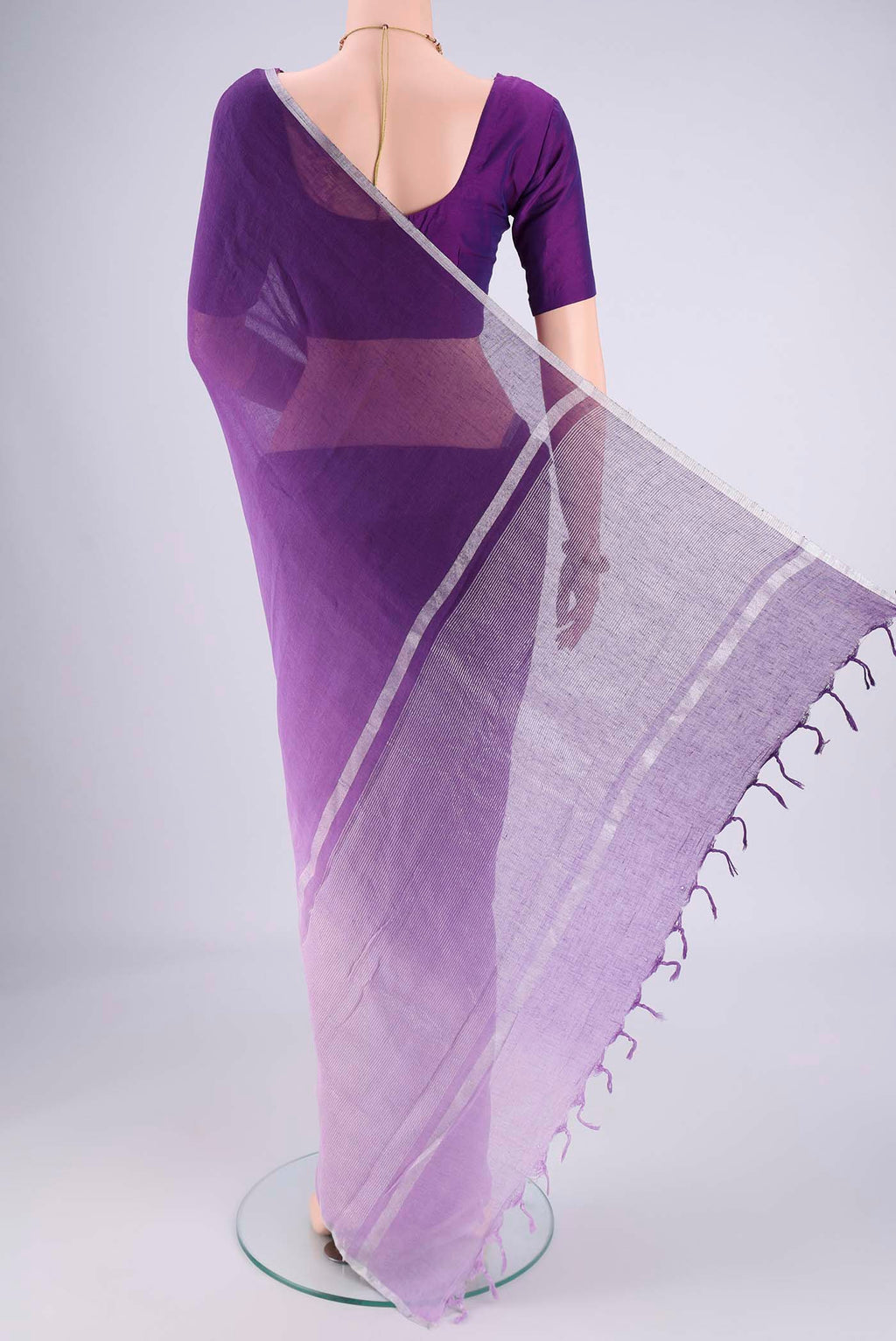 Flat view of Violet Linen Saree with Half And Half on the body and Thin Zari Line. 