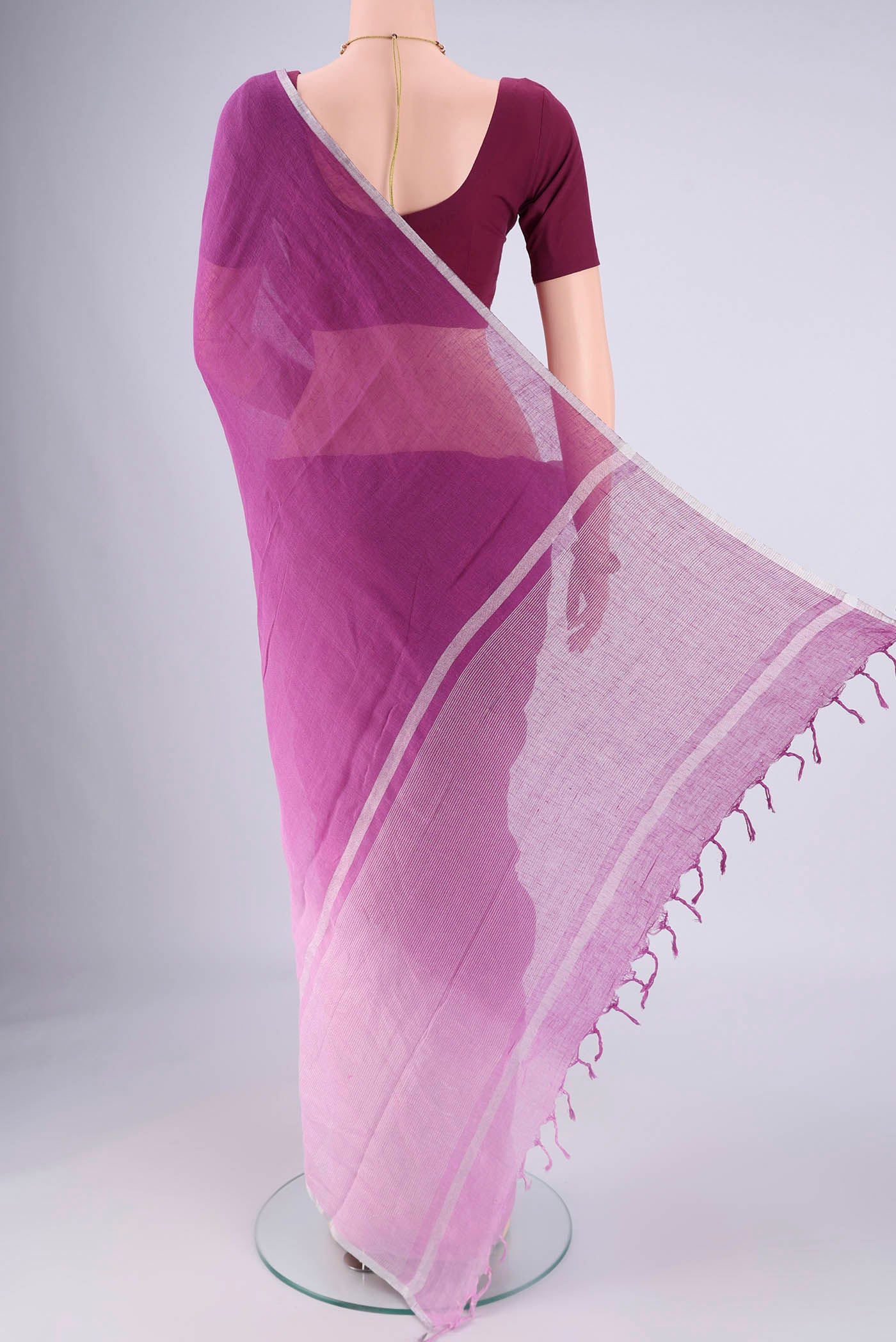 Flat view of Mauve Linen Saree with Half And Half on the body and Thin Zari Line. 