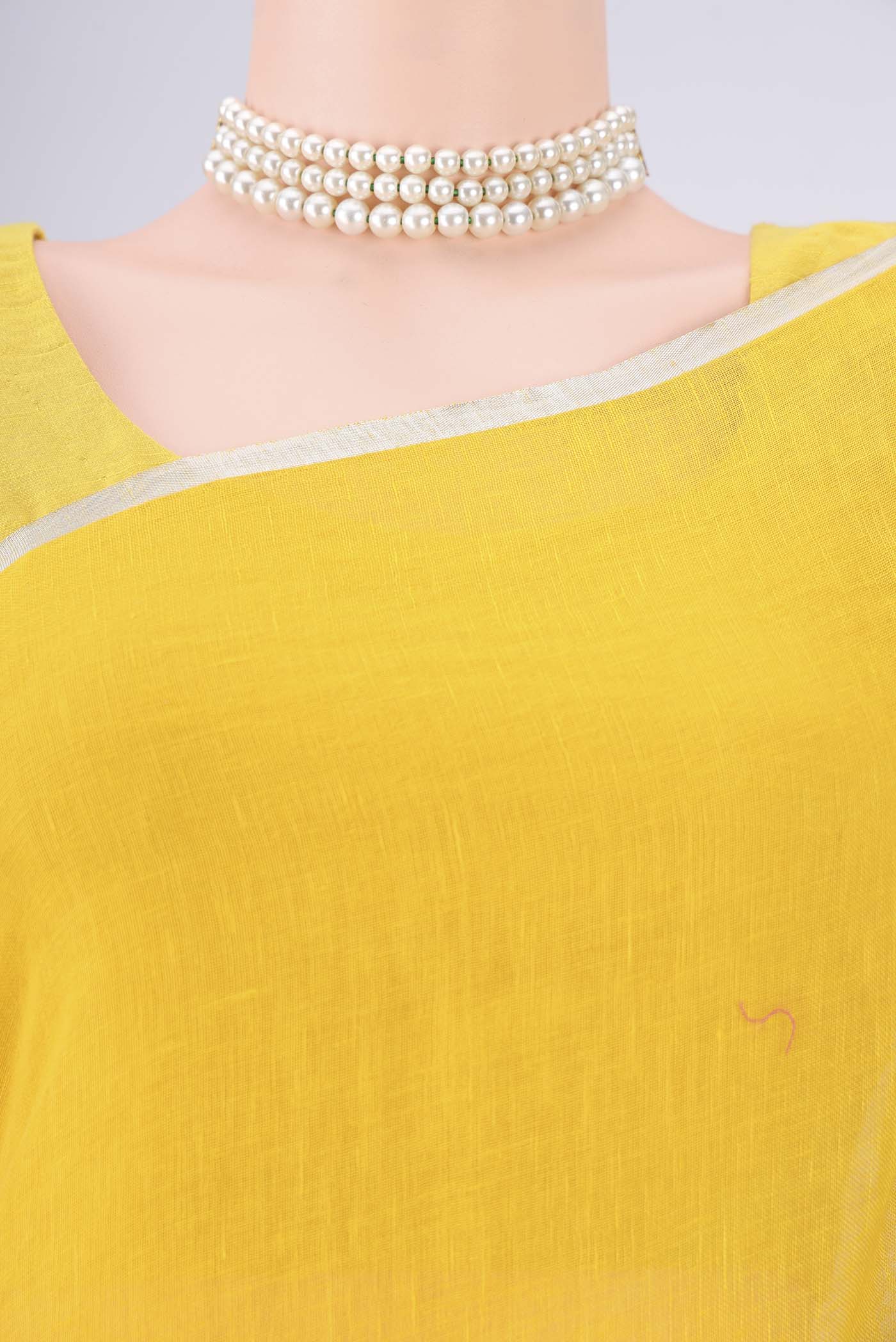 Border image of Lemon Yellow Linen Saree with Half And Half on the body and Thin Zari Line. 