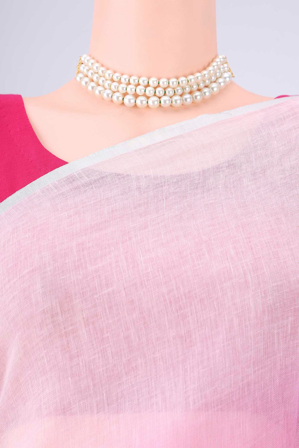 Border image of Rose pink Linen Saree with Half And Half on the body and Thin Zari Line. 