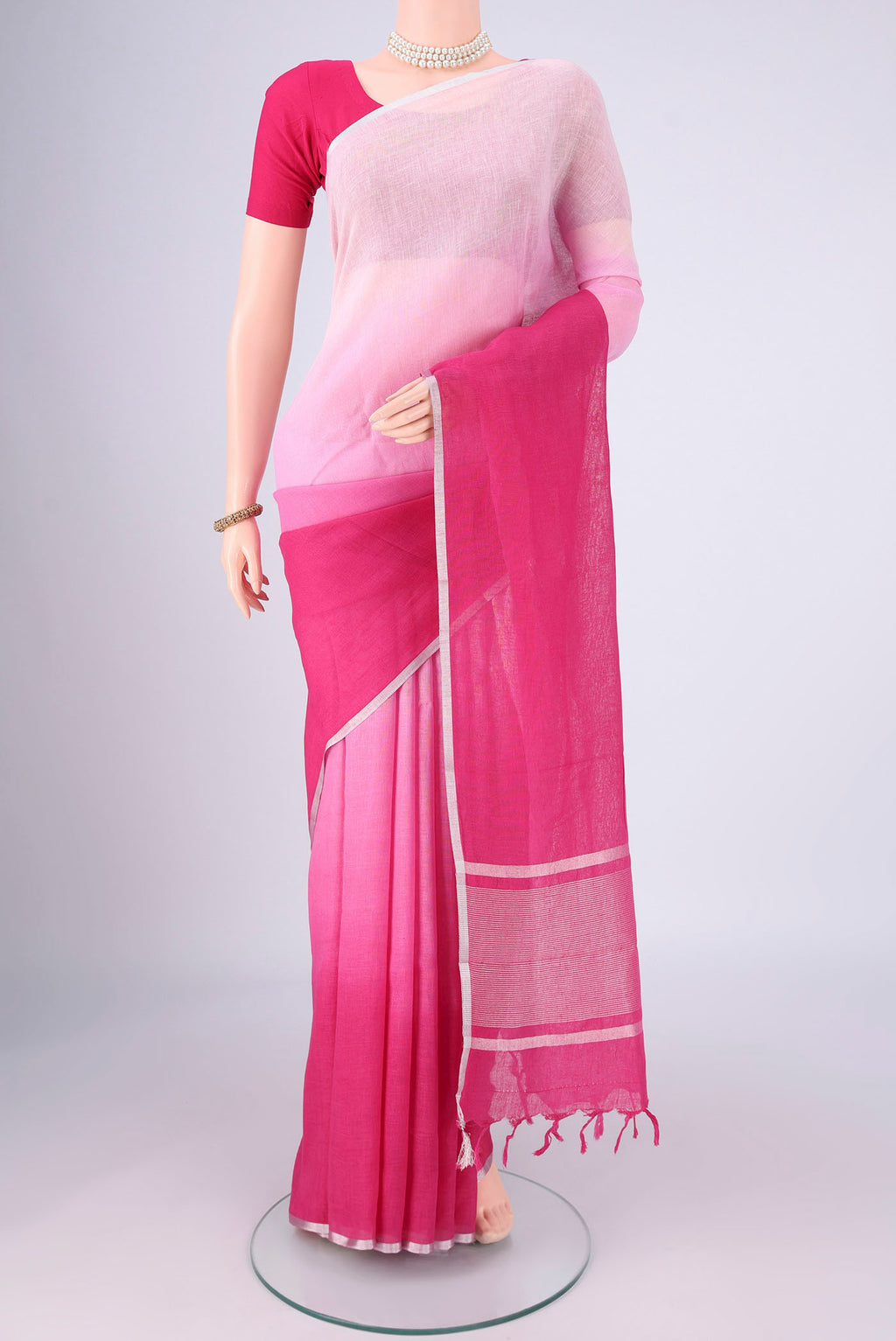 Rose pink Linen Saree with Half And Half on the body and Thin Zari Line.  displayed on a mannequin