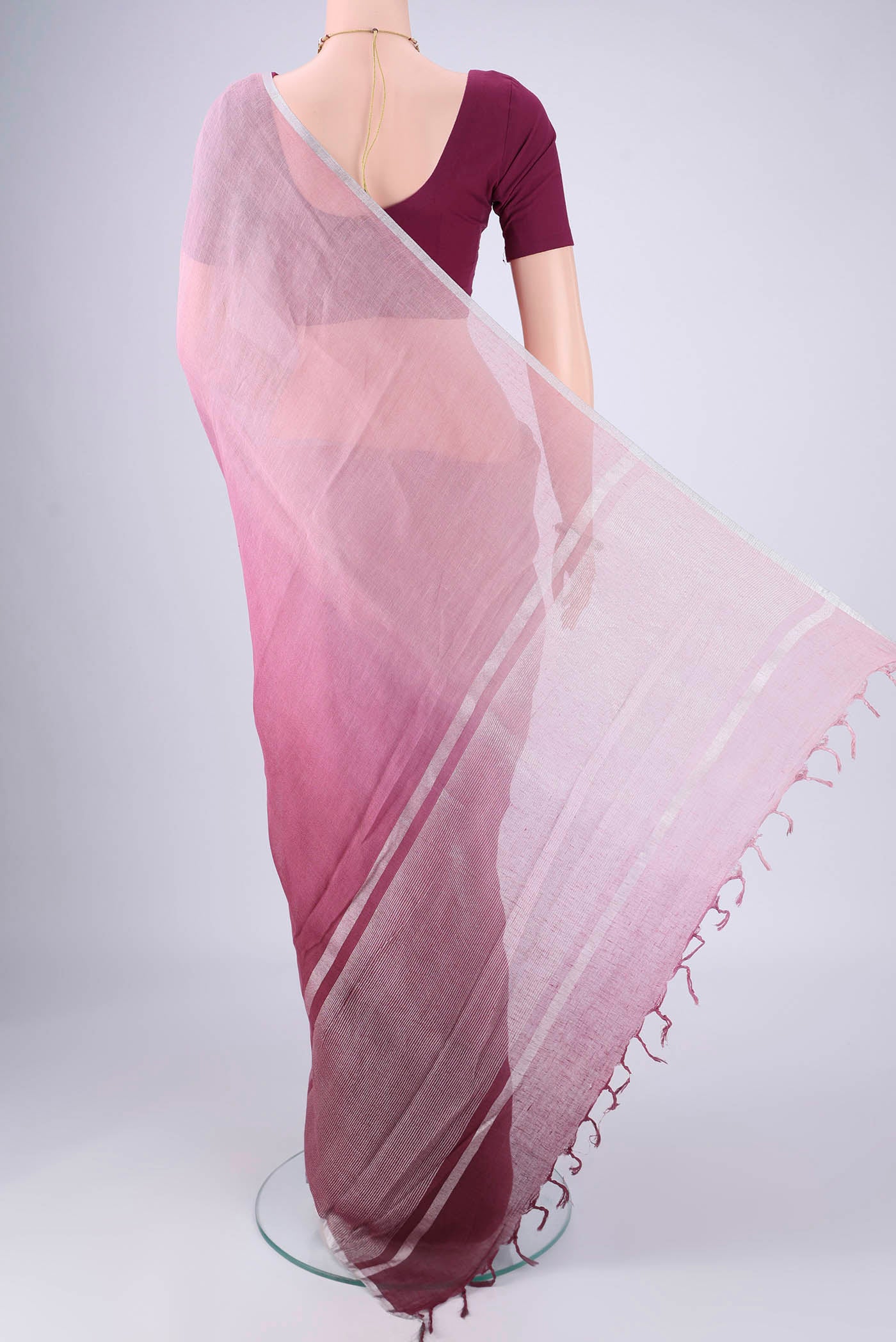 Flat view of Mauve Linen Saree with Plain Body and Zari Border. 