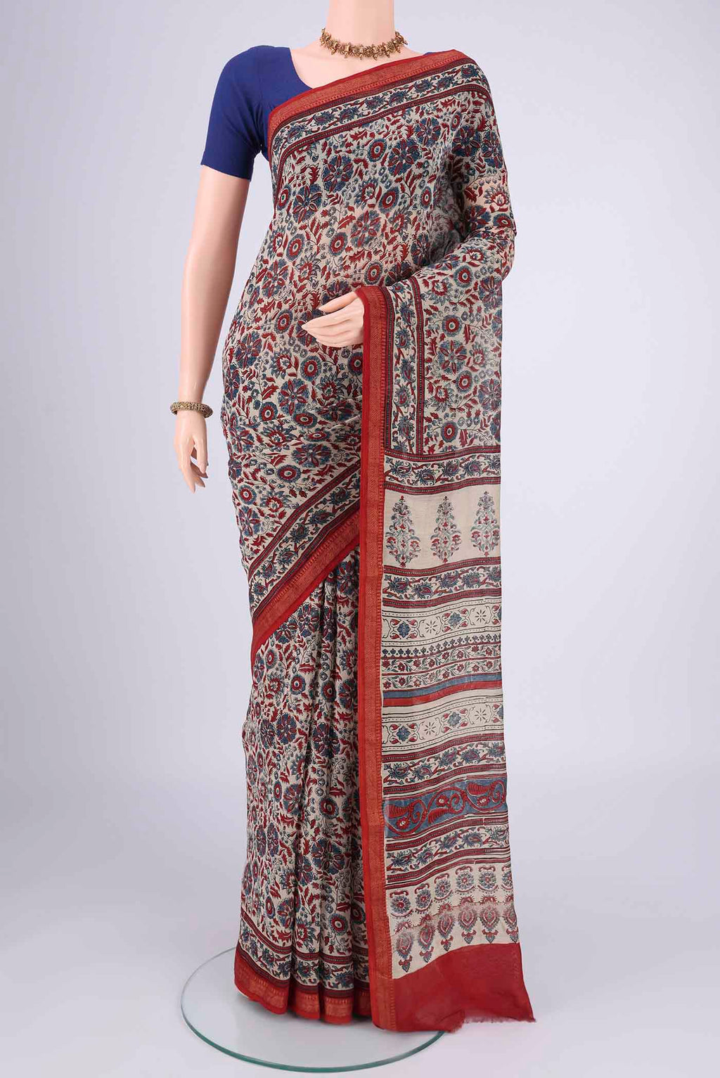Beige Chanderi Silk Cotton Saree with Ajrakh Print on the body and Zari Border.  displayed on a mannequin