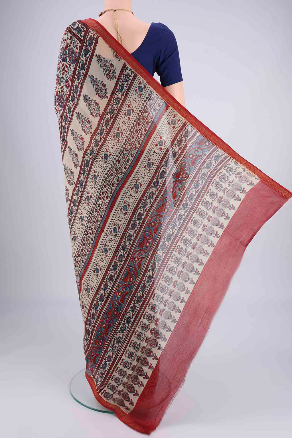 Flat view of Beige Chanderi Silk Cotton Saree with Ajrakh Print on the body and Zari Border. 