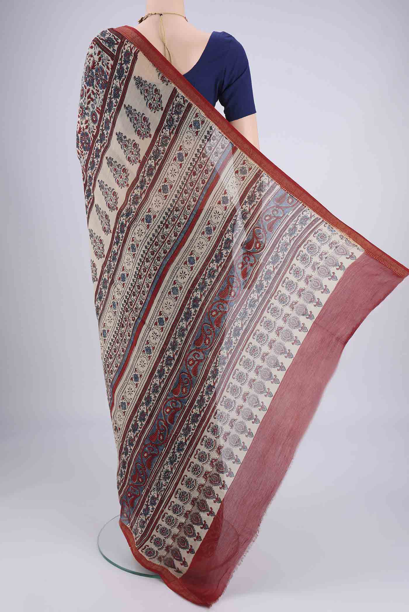 Flat view of Beige Chanderi Silk Cotton Saree with Ajrakh Print on the body and Zari Border. 