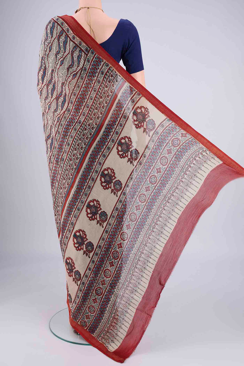 Flat view of Beige Chanderi Silk Cotton Saree with Ajrakh Print on the body and Zari Border. 