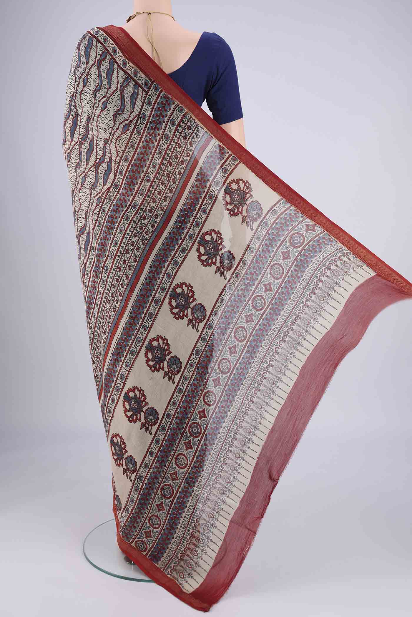 Flat view of Beige Chanderi Silk Cotton Saree with Ajrakh Print on the body and Zari Border. 