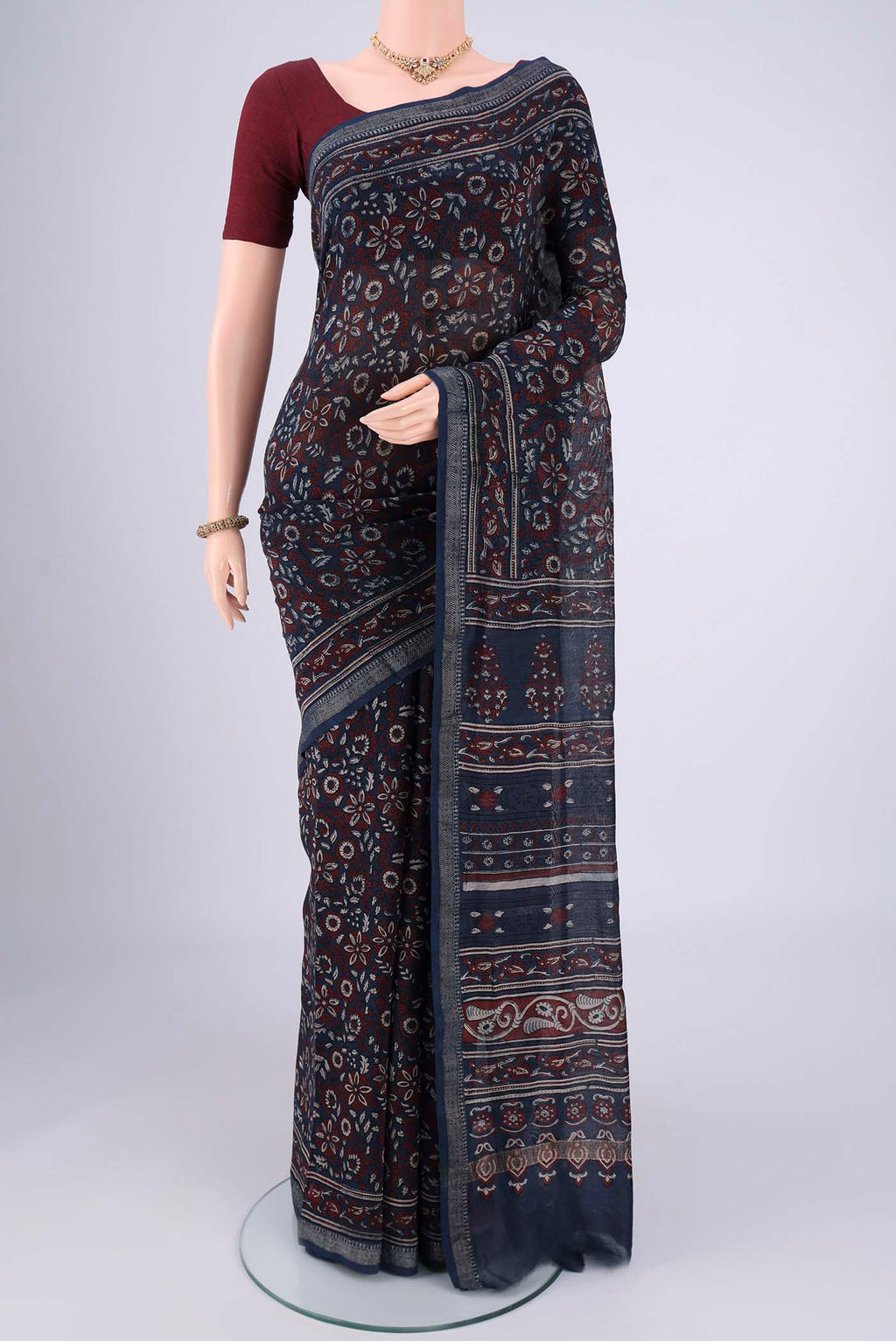 Navy Blue Chanderi Silk Cotton Saree with Ajrakh Print on the body and Zari Border.  displayed on a mannequin