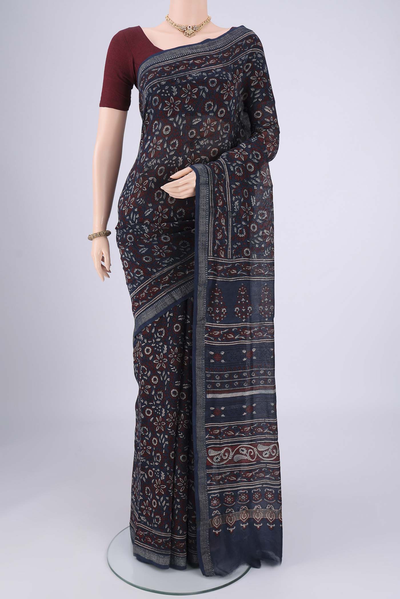 Navy Blue Chanderi Silk Cotton Saree with Ajrakh Print on the body and Zari Border.  displayed on a mannequin