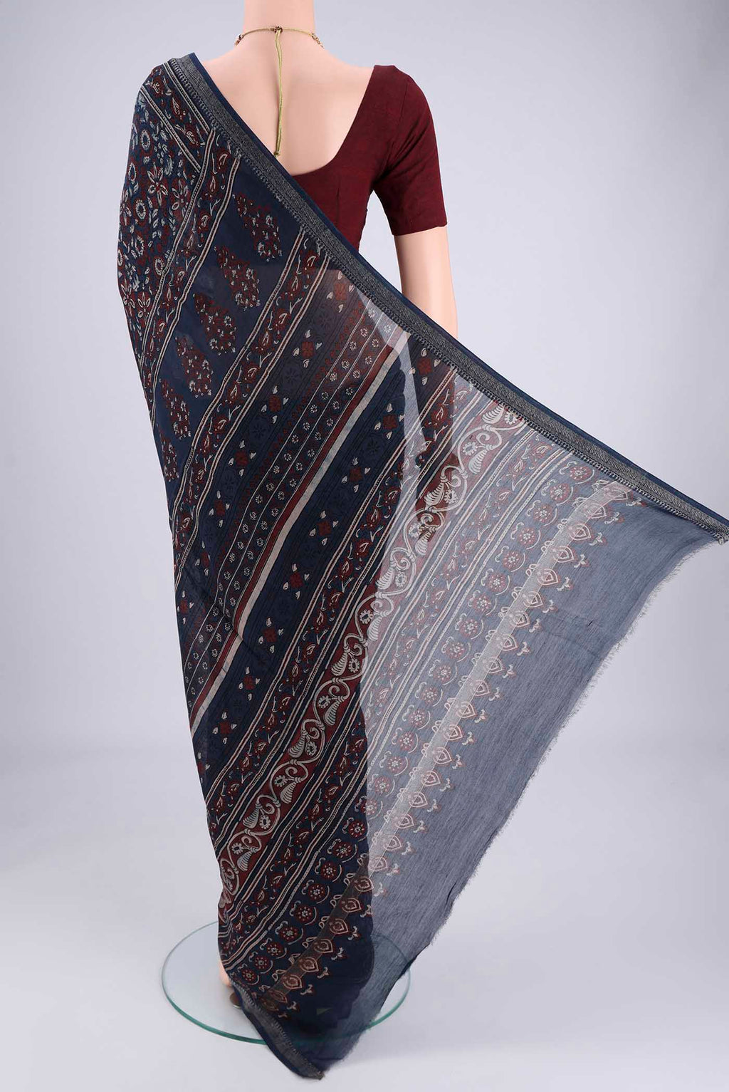 Flat view of Navy Blue Chanderi Silk Cotton Saree with Ajrakh Print on the body and Zari Border. 