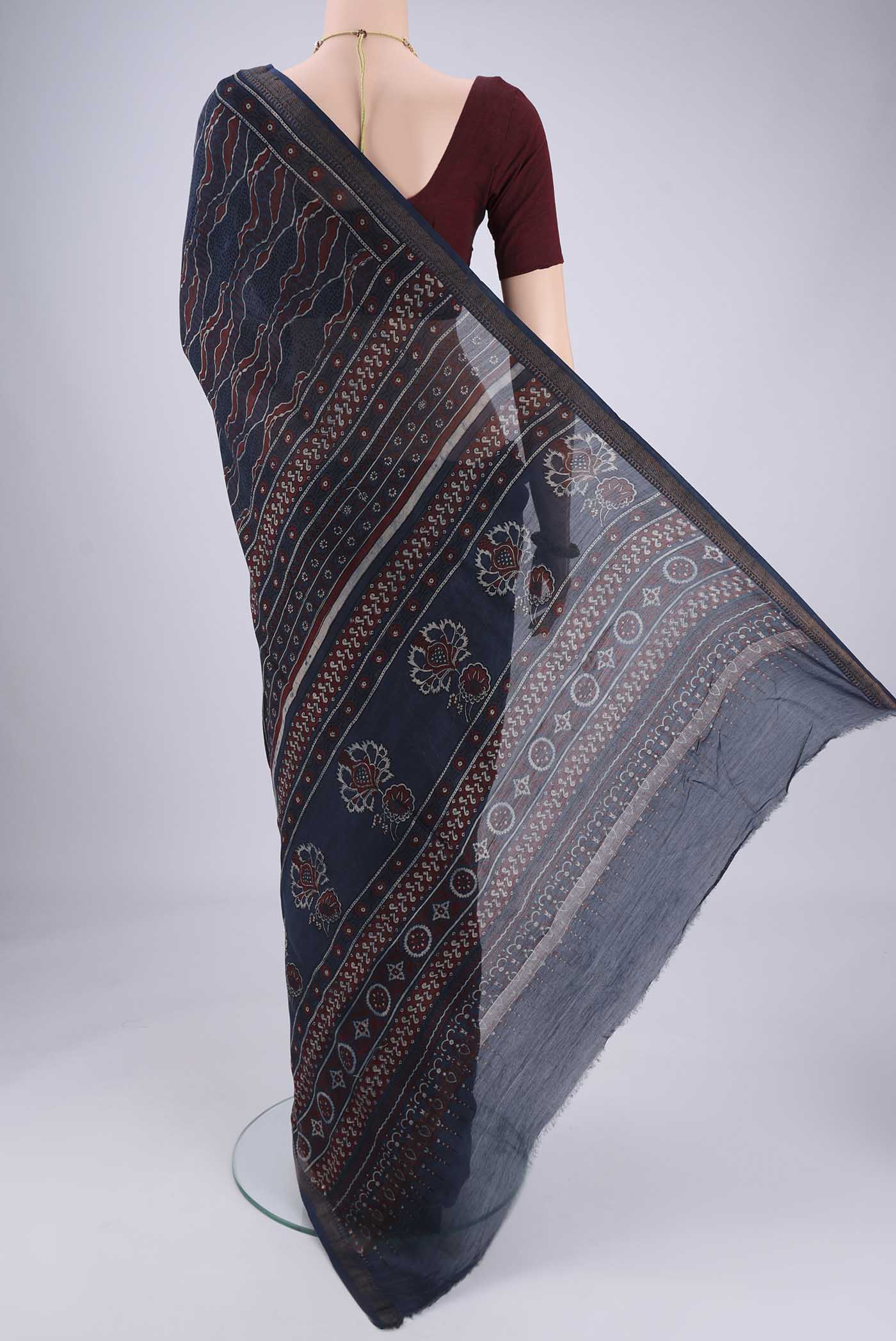 Flat view of Navy Blue Chanderi Silk Cotton Saree with Ajrakh Print on the body and Zari Border. 