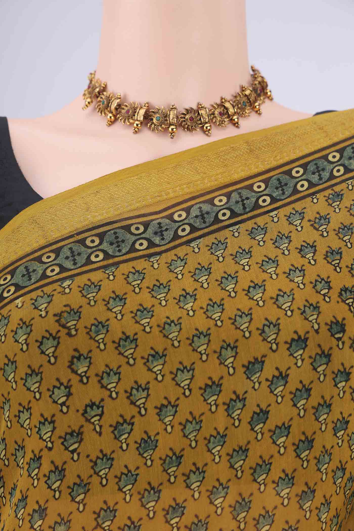 Border image of Mustard Chanderi Silk Cotton Saree with Ajrakh Print on the body and Zari Border. 
