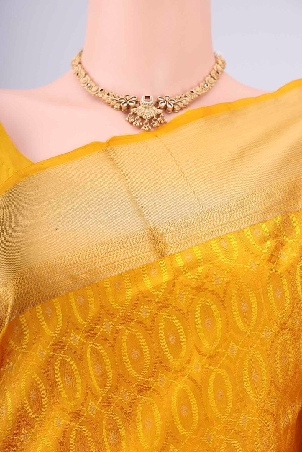 Border image of Yellow Soft Silk Saree with Jacquard With Thread Butta on the body and Zari Border. 