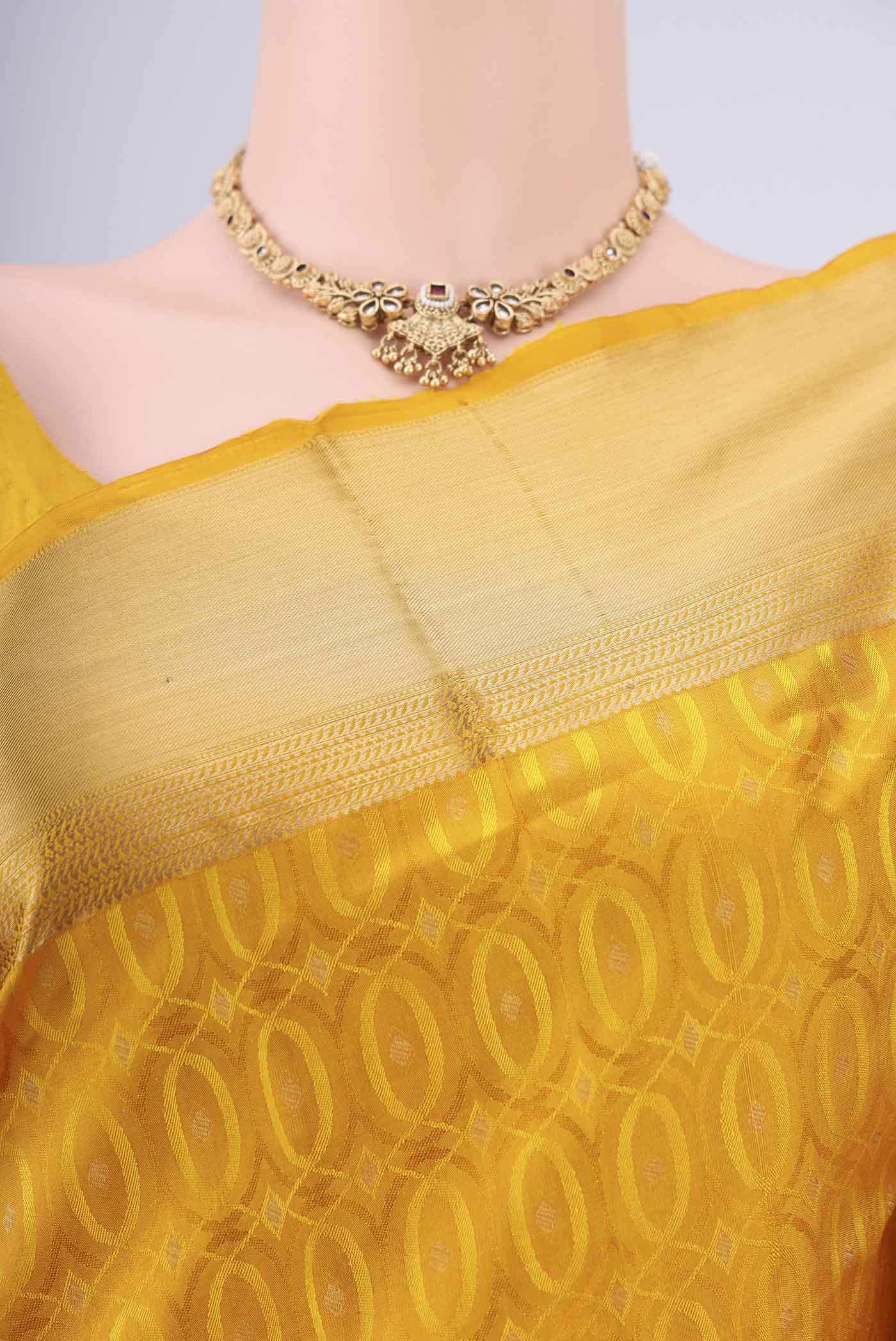Border image of Yellow Soft Silk Saree with Jacquard With Thread Butta on the body and Zari Border. 