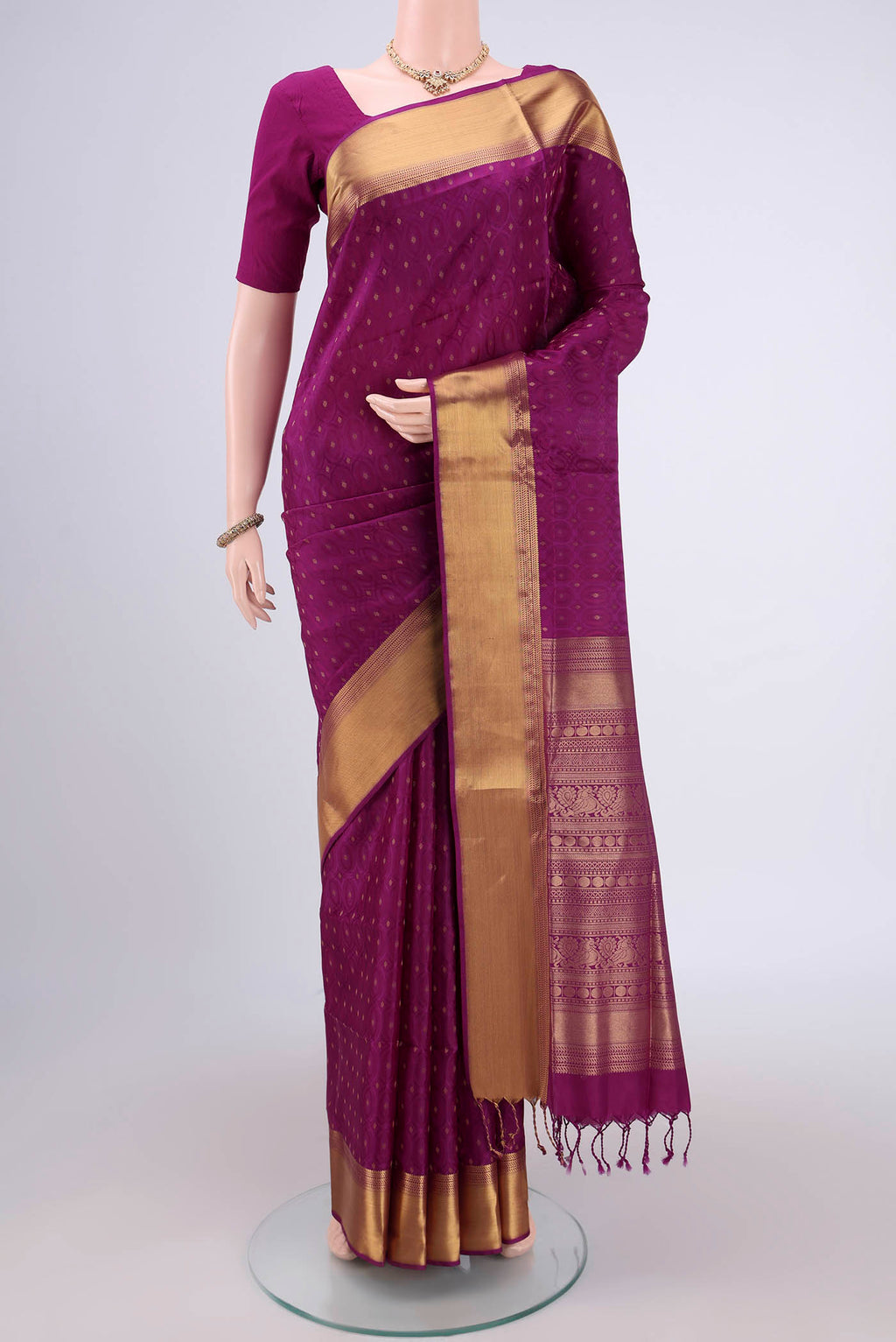 Magenta Baluchari Silk Saree with Jacquard With Zari Butta on the body and Zari Border.  displayed on a mannequin