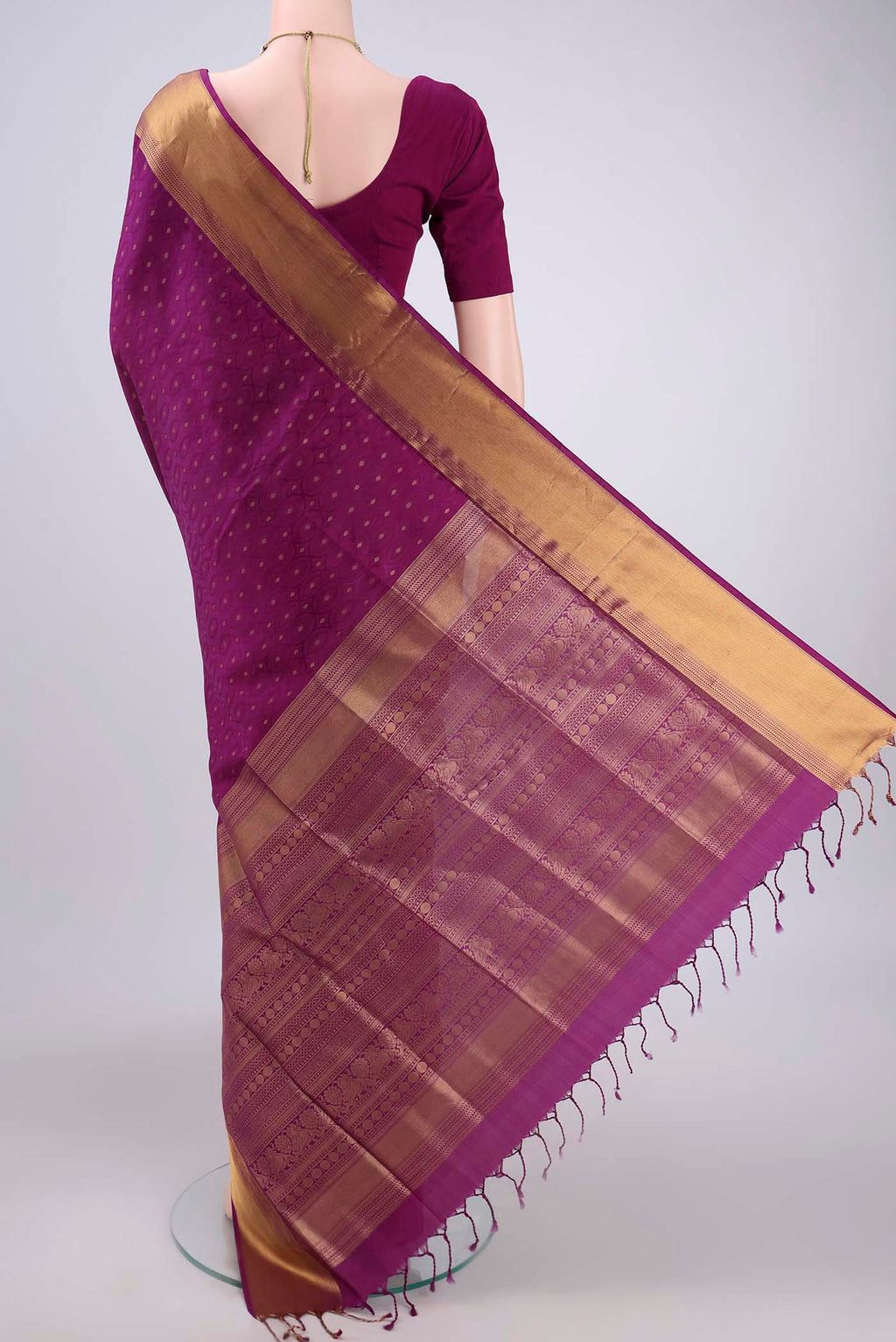 Flat view of Magenta Baluchari Silk Saree with Jacquard With Zari Butta on the body and Zari Border. 