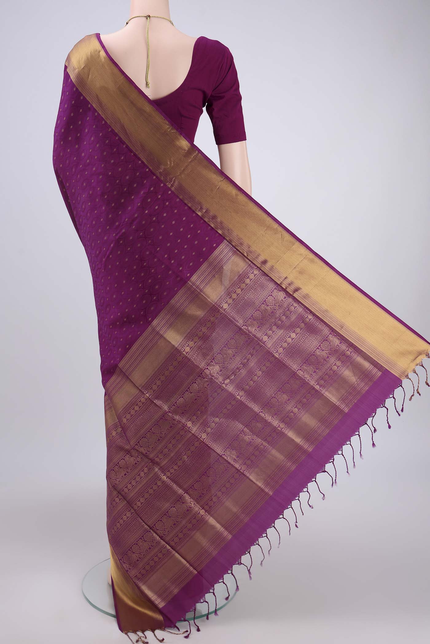 Flat view of Magenta Baluchari Silk Saree with Jacquard With Zari Butta on the body and Zari Border. 