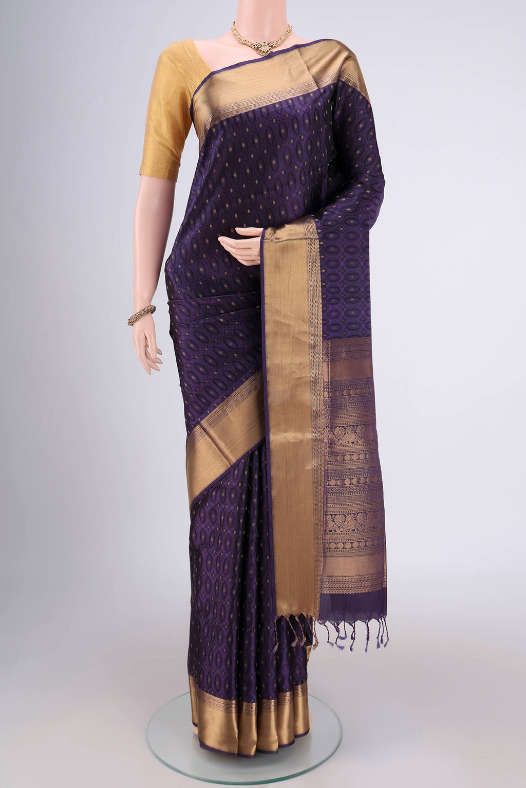 Purple Baluchari Silk Saree with Jacquard With Zari Butta on the body and Zari Border.  displayed on a mannequin