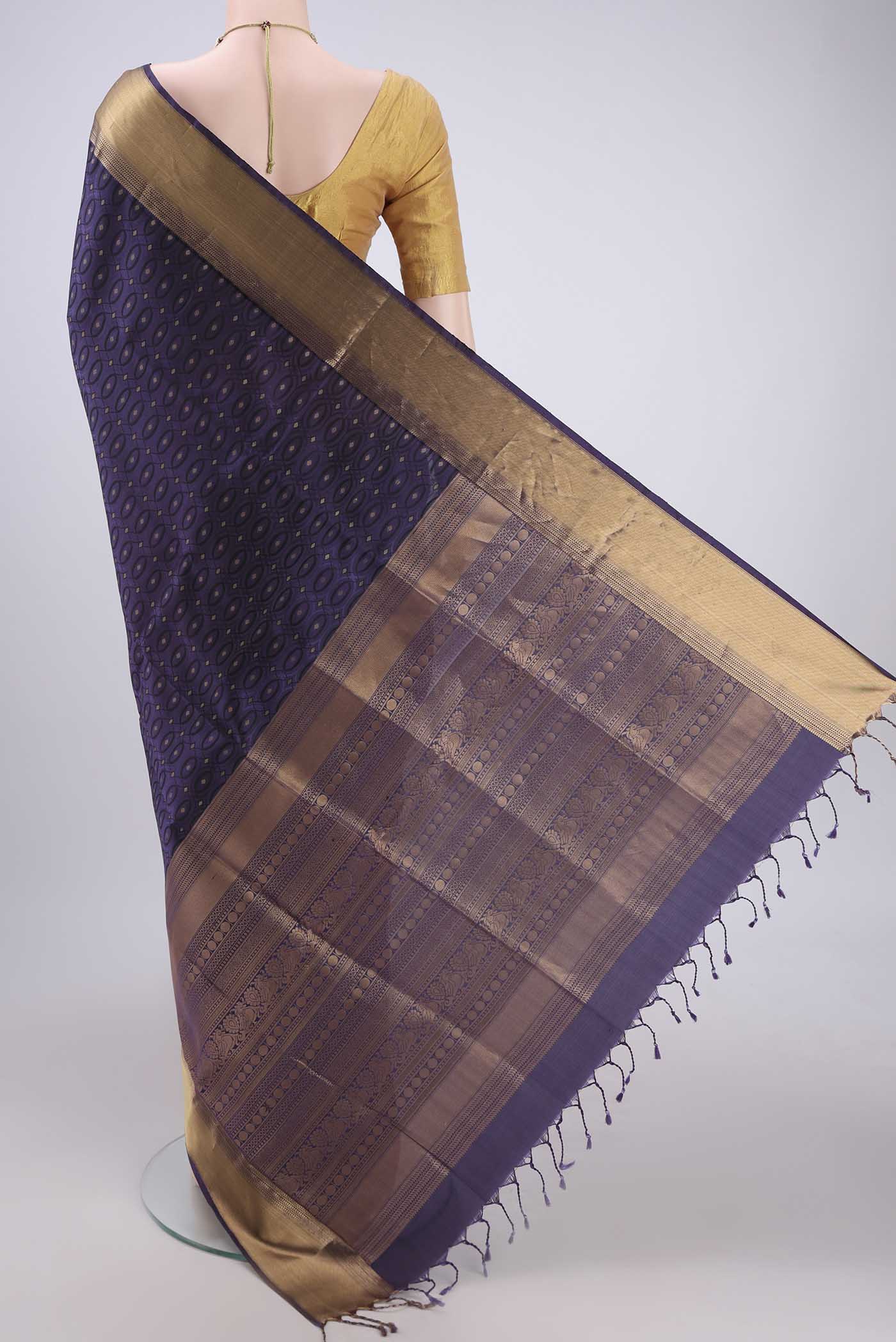 Flat view of Purple Baluchari Silk Saree with Jacquard With Zari Butta on the body and Zari Border. 