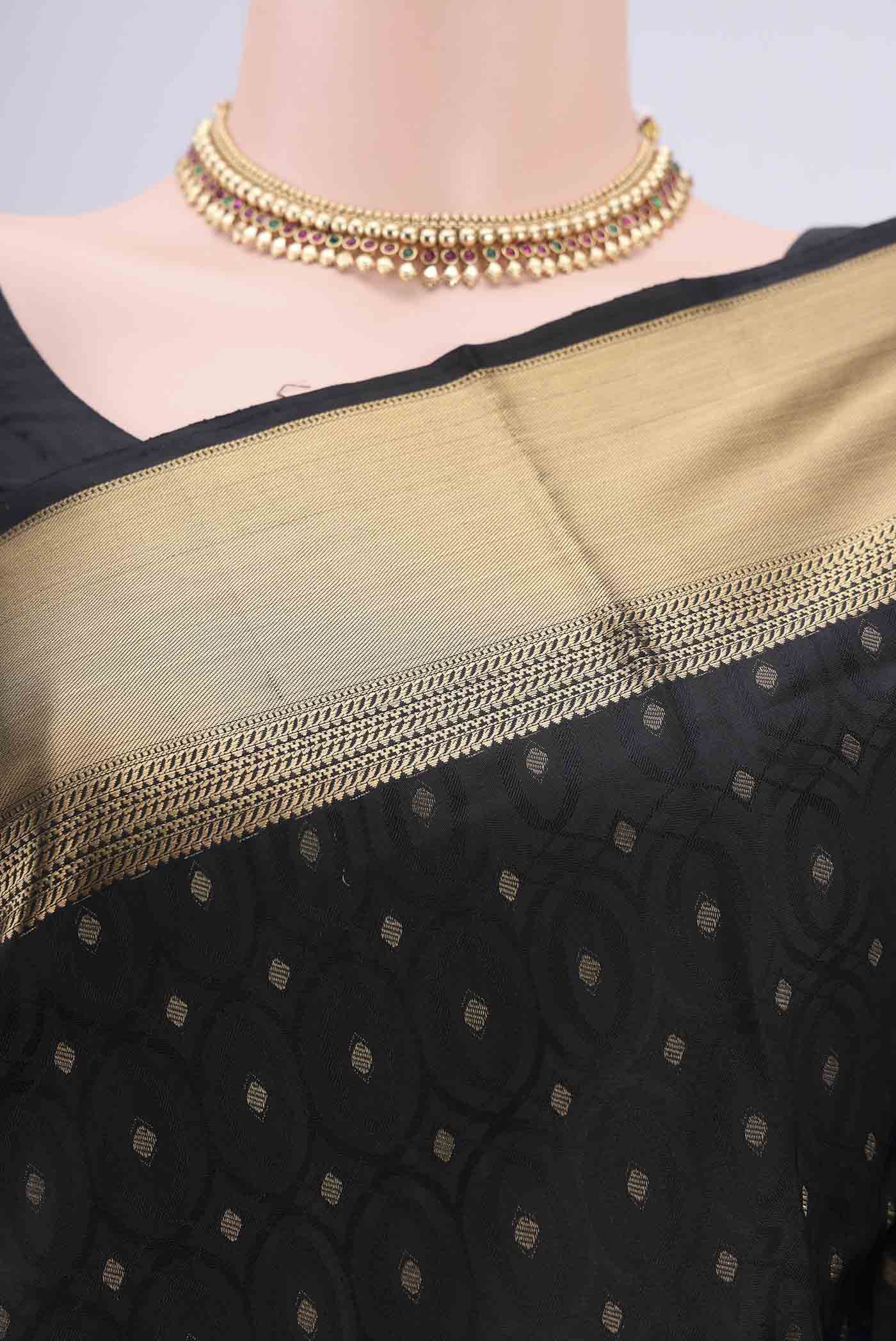 Border image of Black Baluchari Silk Saree with Jacquard With Zari Butta on the body and Zari Border. 