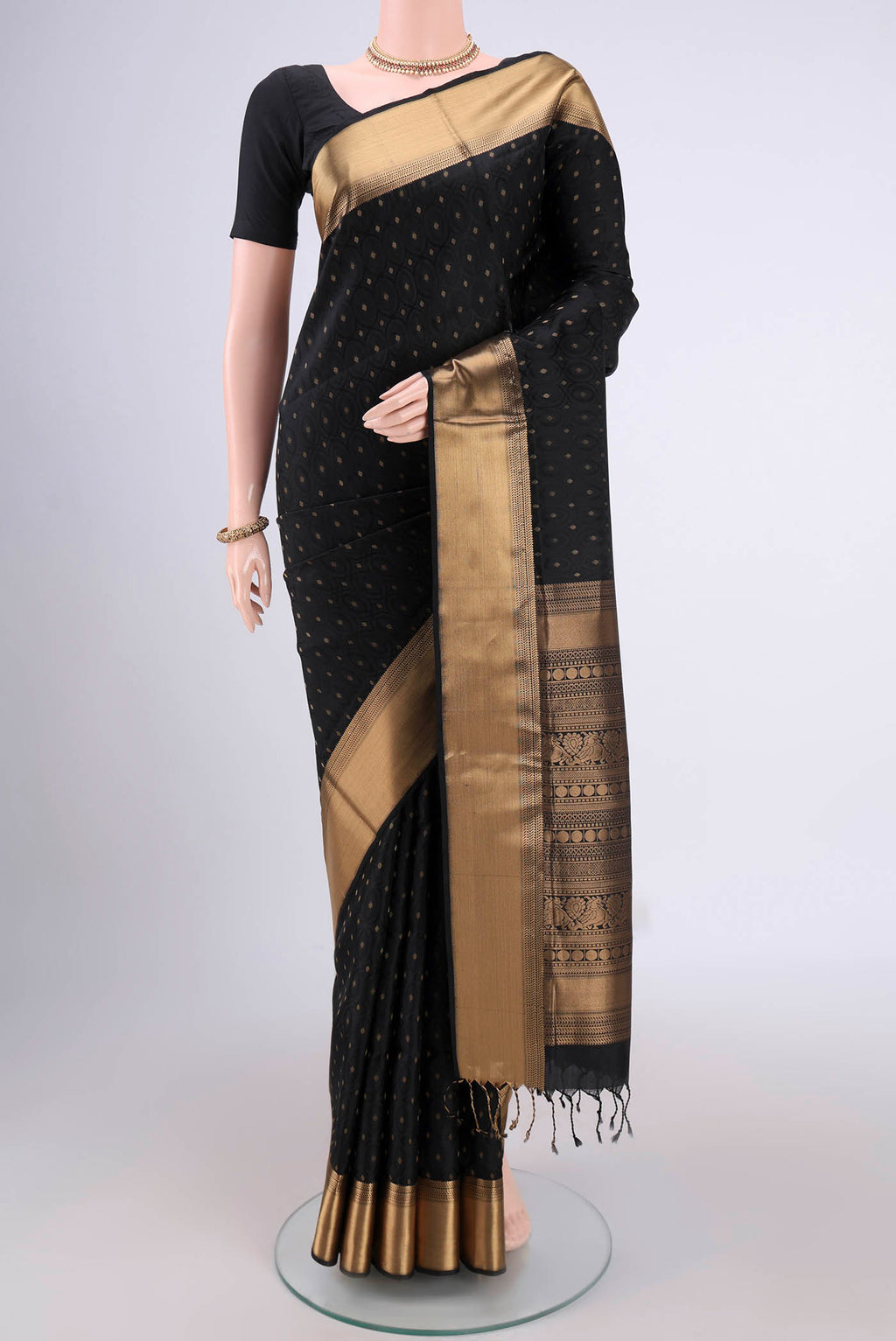 Black Baluchari Silk Saree with Jacquard With Zari Butta on the body and Zari Border.  displayed on a mannequin