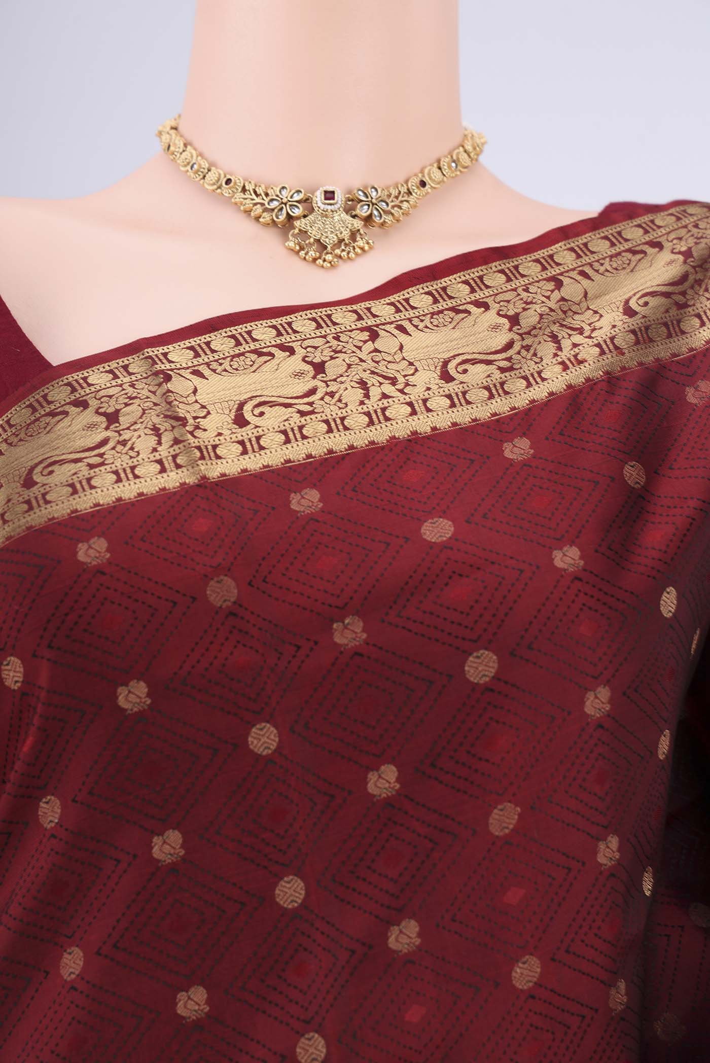Border image of Maroon Soft Silk Saree with Jacquard With Thread Butta on the body and Zari Border. 