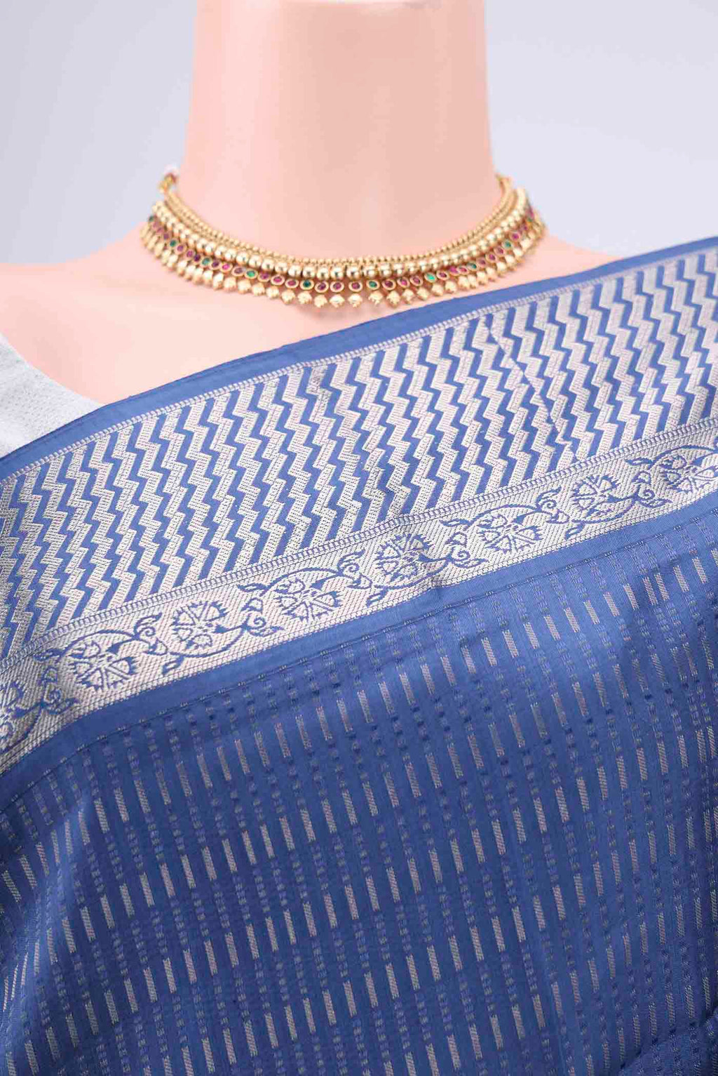 Border image of Blue Baluchari Silk Saree with Jacquard design on the body and Zari Border. 