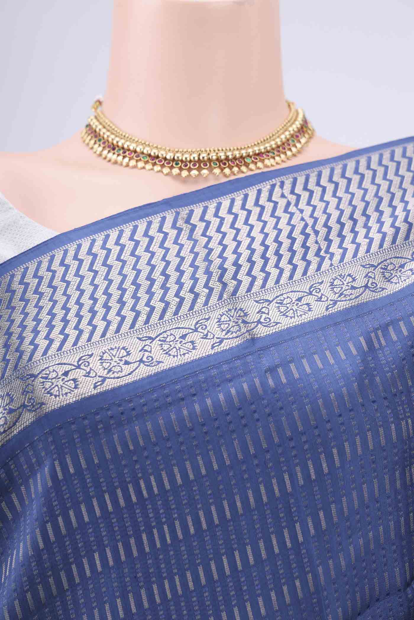 Border image of Blue Baluchari Silk Saree with Jacquard design on the body and Zari Border. 