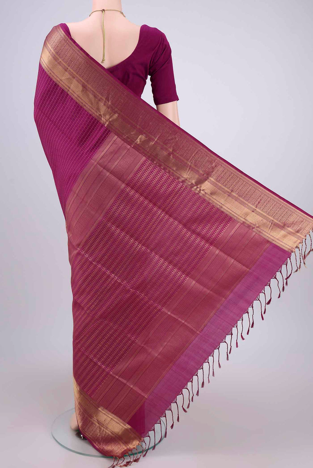 Flat view of Magenta Baluchari Silk Saree with Jacquard With Zari Butta on the body and Zari Border. 