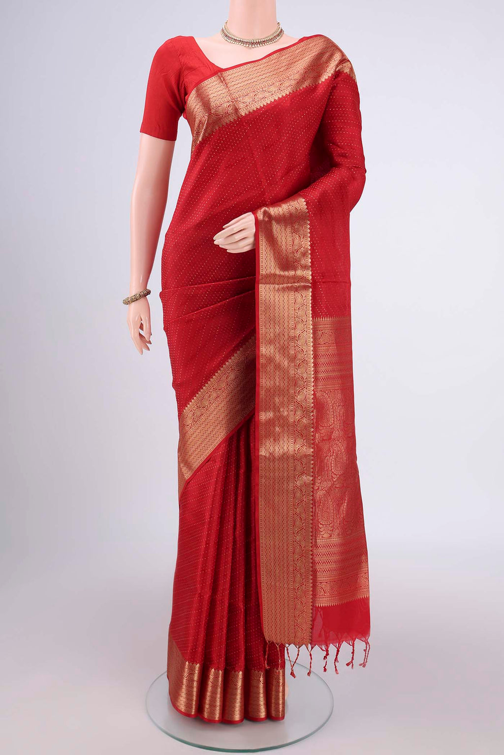 Red Baluchari Silk Saree with Jacquard With Zari Butta on the body and Zari Border.  displayed on a mannequin
