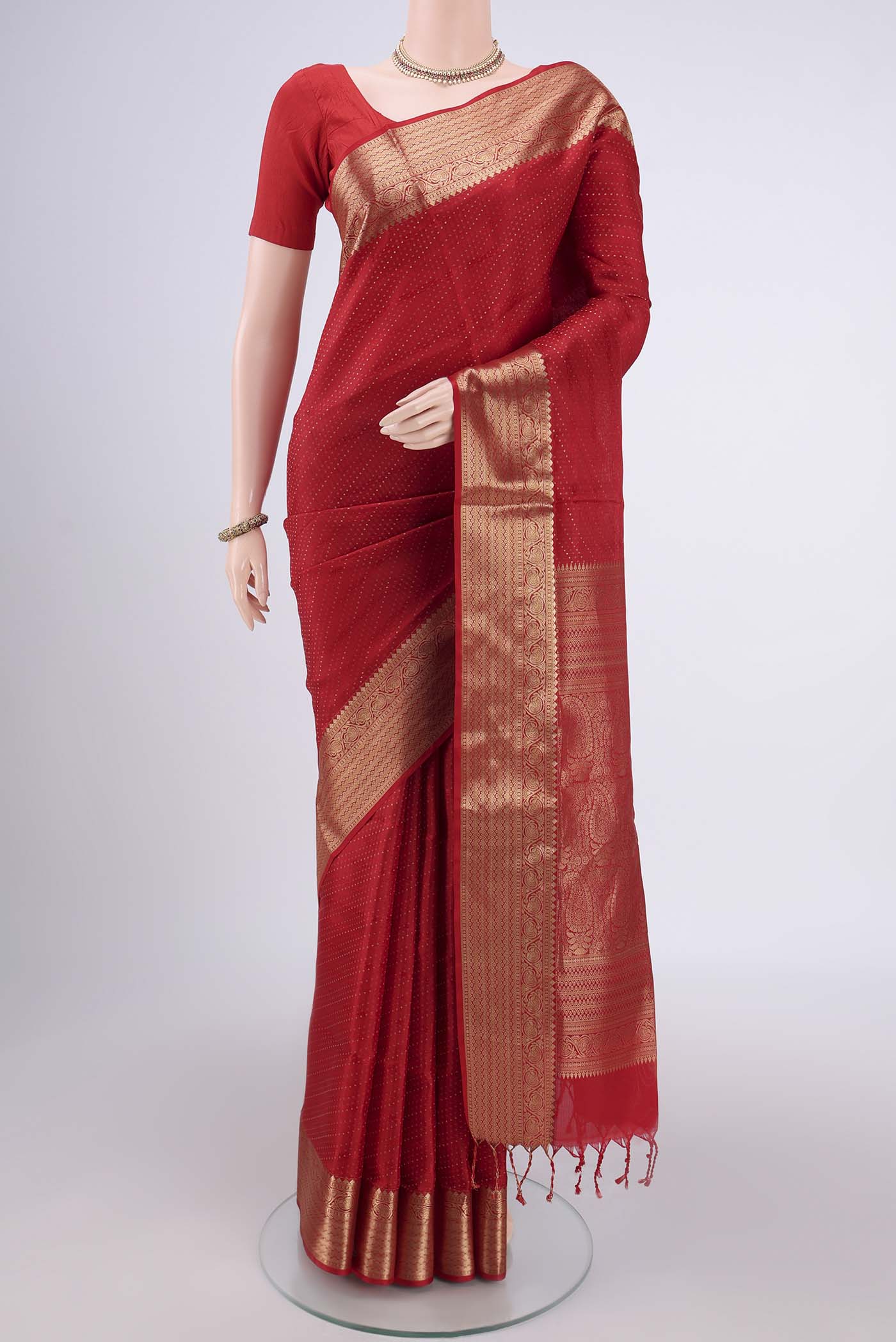 Red Baluchari Silk Saree with Jacquard With Zari Butta on the body and Zari Border.  displayed on a mannequin