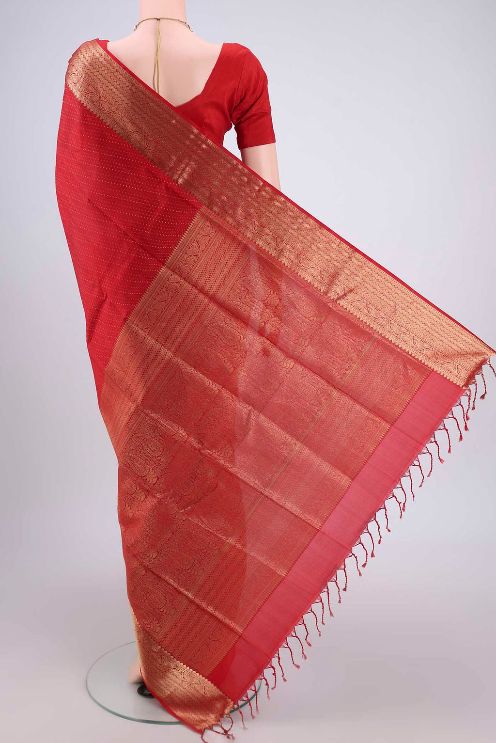 Flat view of Red Baluchari Silk Saree with Jacquard With Zari Butta on the body and Zari Border. 