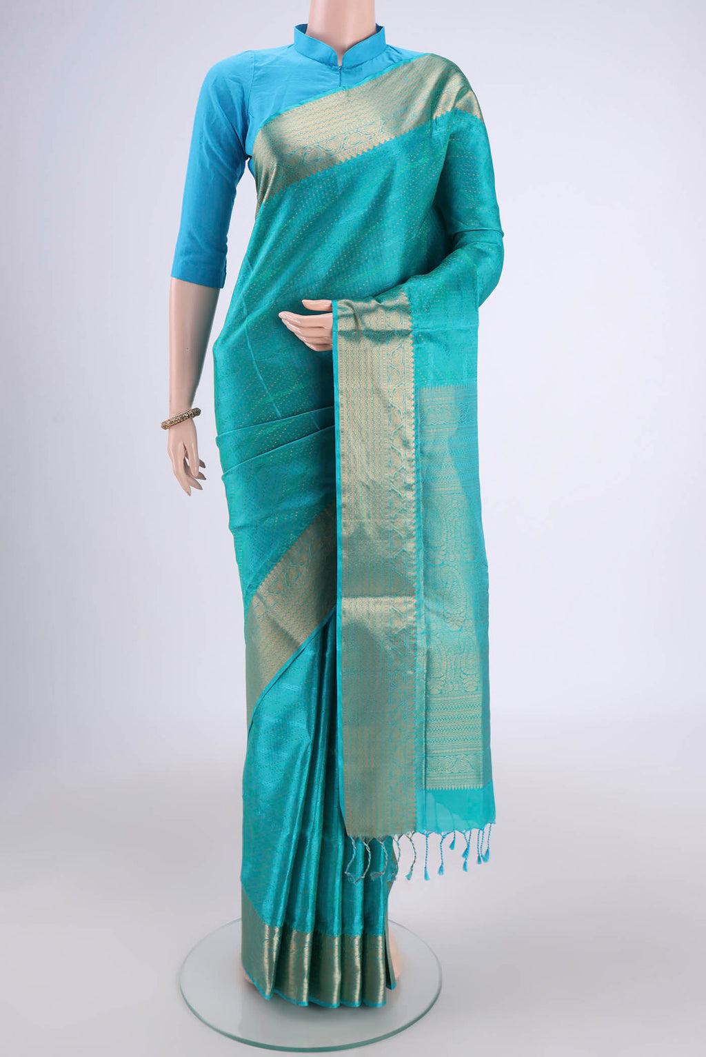 Turquoise Dual Tone Baluchari Silk Saree with Jacquard With Zari Butta on the body and Zari Border.  displayed on a mannequin