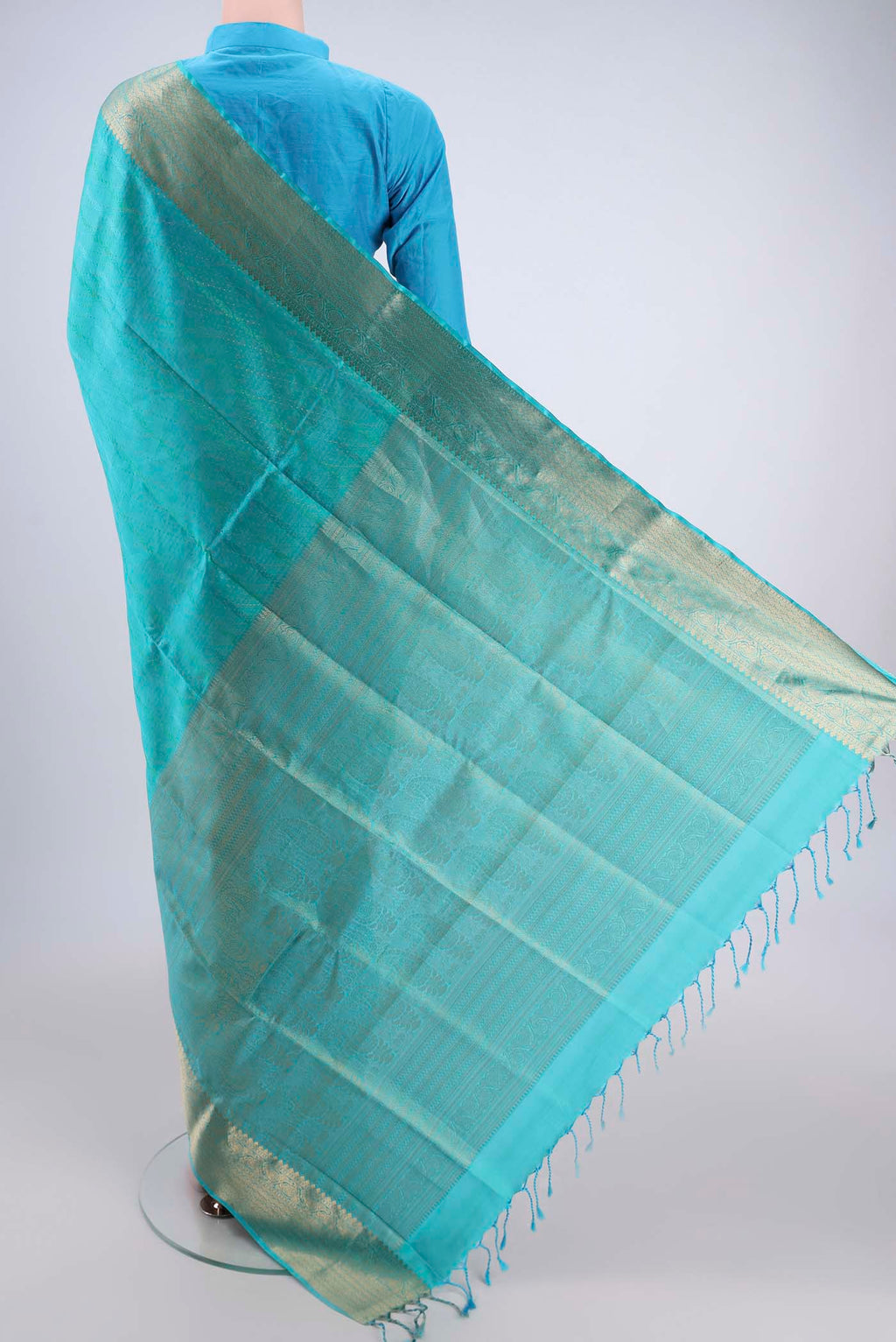 Flat view of Turquoise Dual Tone Baluchari Silk Saree with Jacquard With Zari Butta on the body and Zari Border. 