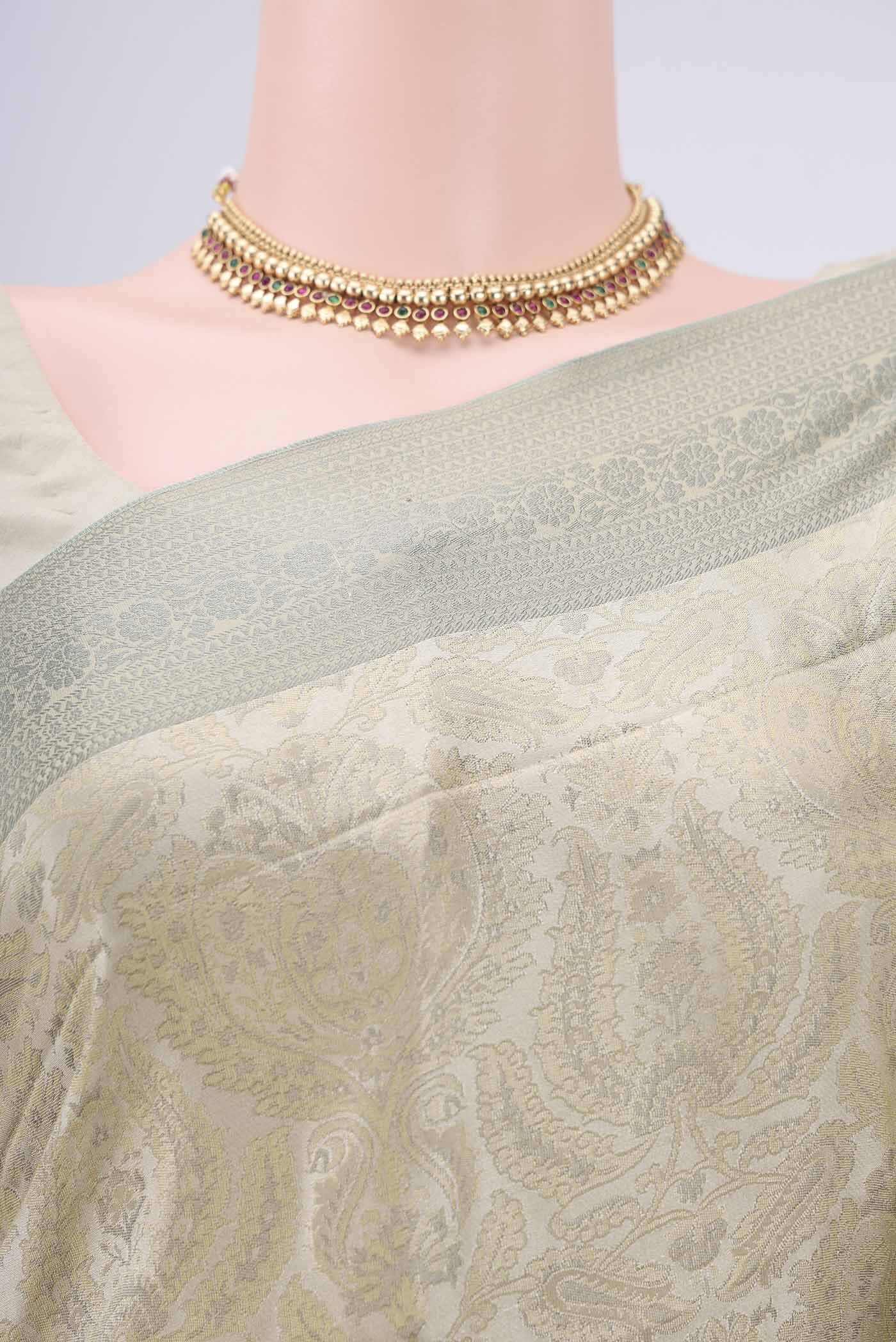 Border image of Beige Dual Tone Baluchari Silk Saree with Jacquard design on the body and Zari Border. 
