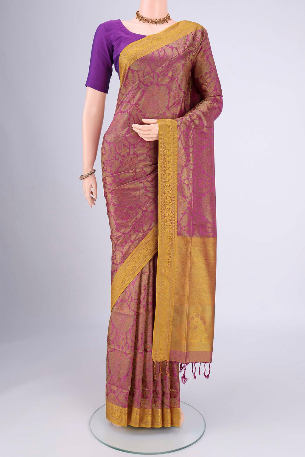 Magenta Soft Silk Saree with Jacquard design on the body and Thread Border.  displayed on a mannequin