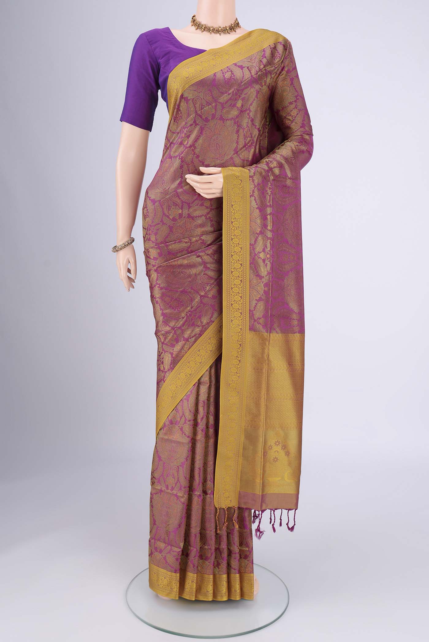 Magenta Soft Silk Saree with Jacquard design on the body and Thread Border.  displayed on a mannequin