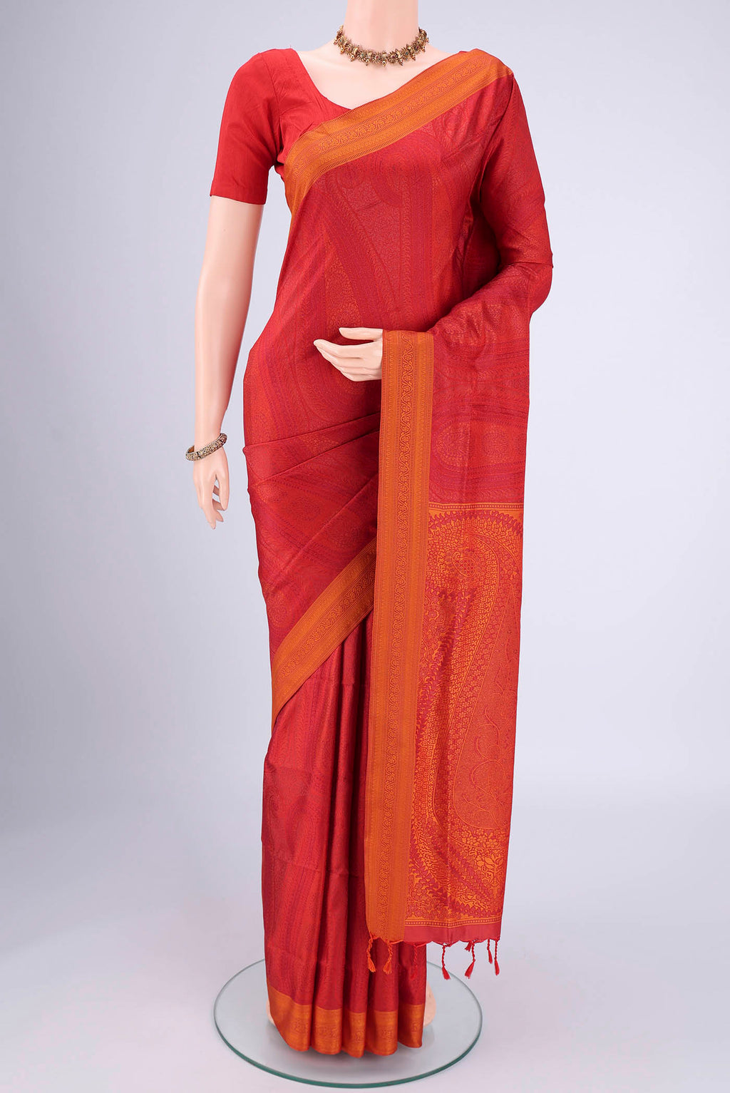 Red Soft Silk Saree with Jacquard design on the body and Thread Border.  displayed on a mannequin