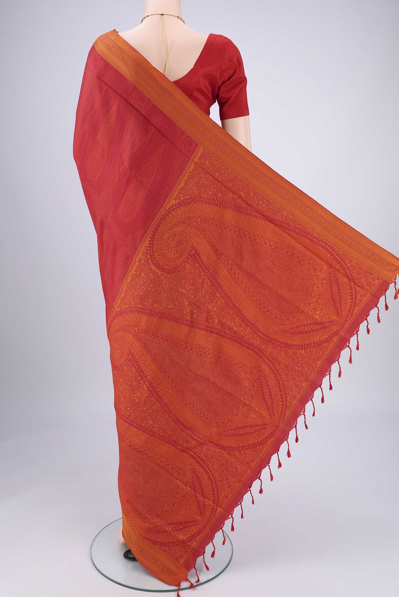 Flat view of Red Soft Silk Saree with Jacquard design on the body and Thread Border. 