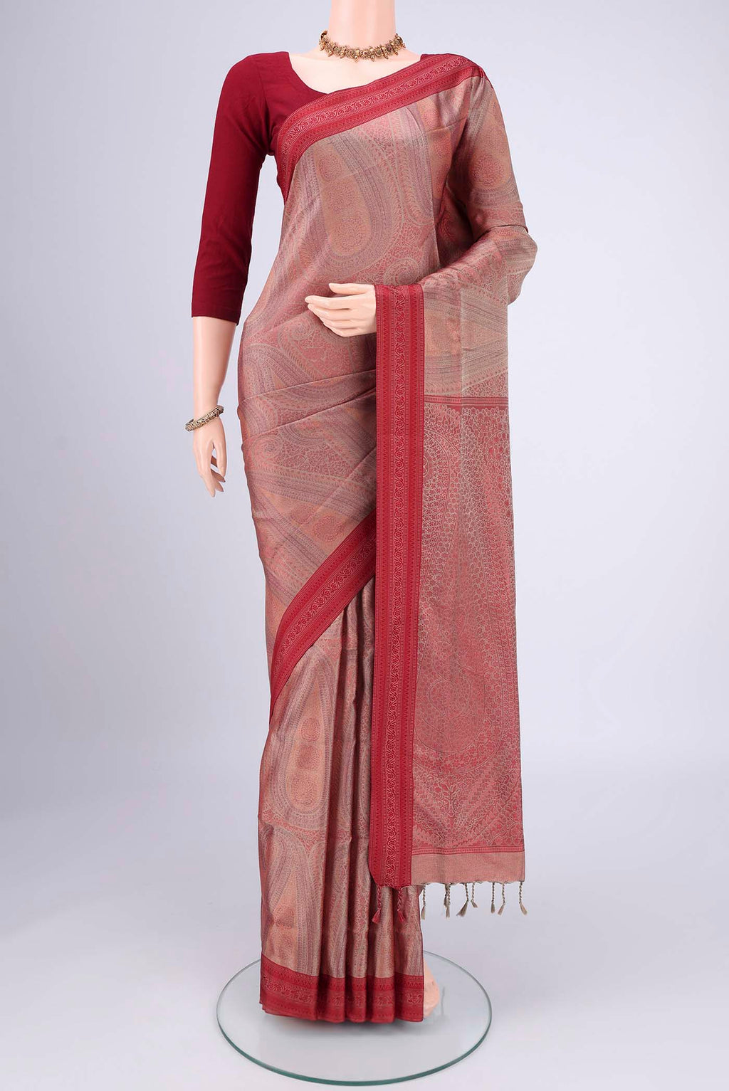 Coral Soft Silk Saree with Jacquard design on the body and Thread Border.  displayed on a mannequin