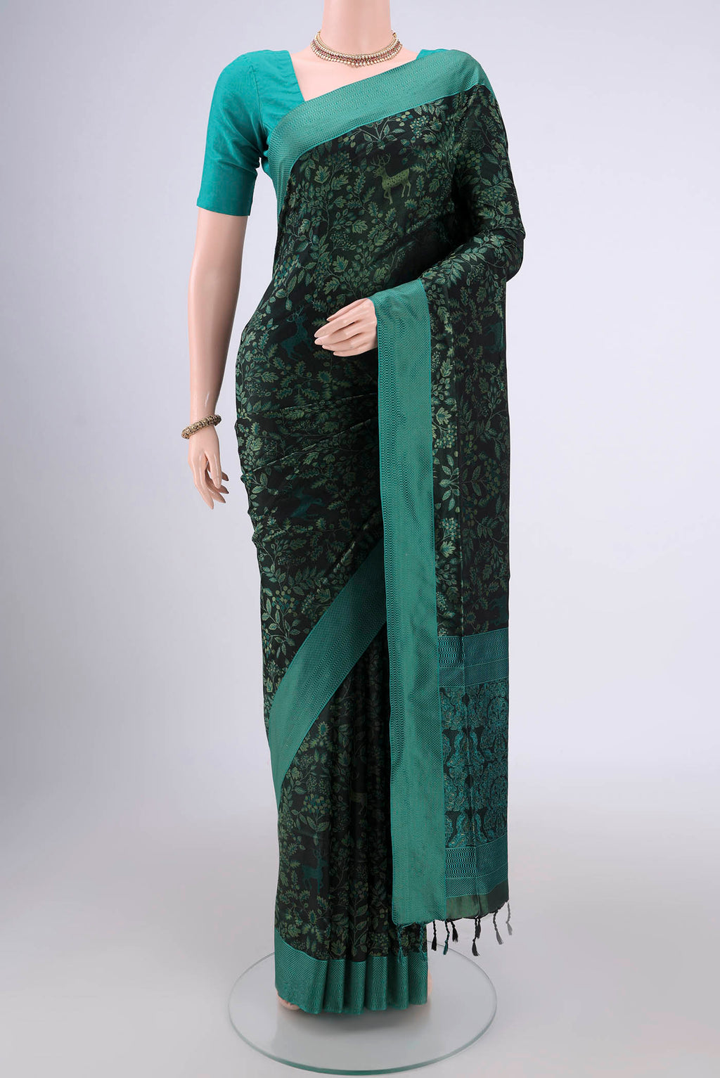 Olive Green Dual Tone Baluchari Silk Saree with Jacquard design on the body and Zari Border.  displayed on a mannequin